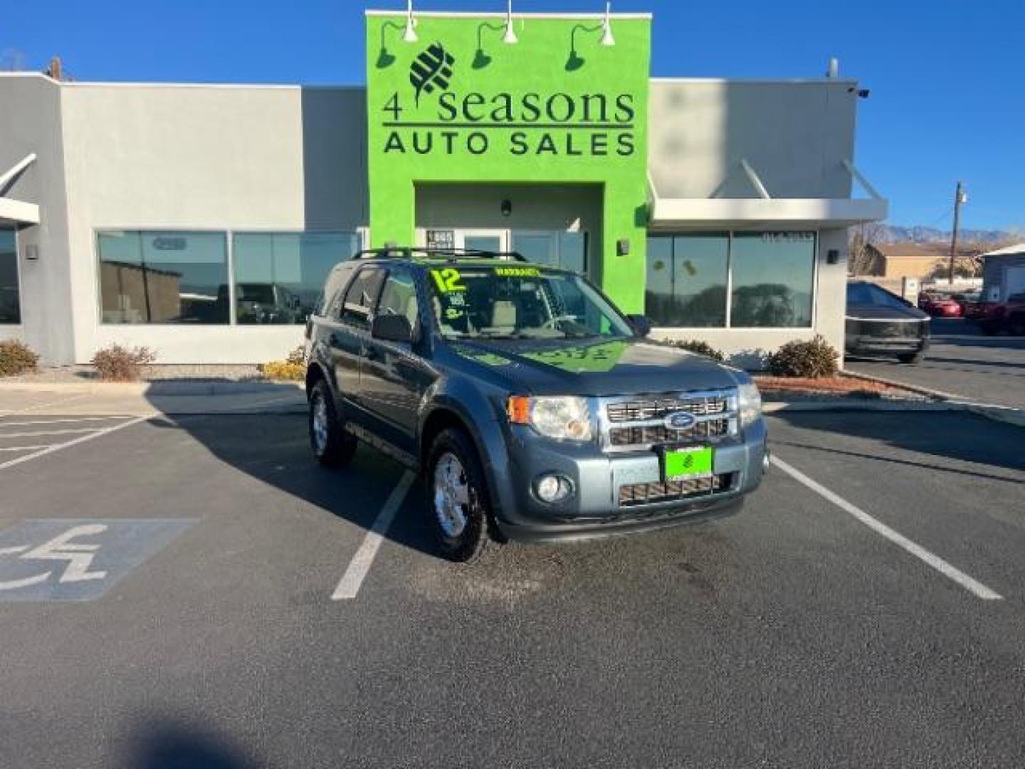 2012 Steel Blue Metallic /Camel Cloth Interior Ford Escape XLT FWD (1FMCU0DG8CK) with an 3.0L V6 DOHC 24V engine, 6-Speed Automatic transmission, located at 940 North Main Street, Cedar City, UT, 84720, (435) 628-0023, 37.692936, -113.061897 - Photo#0