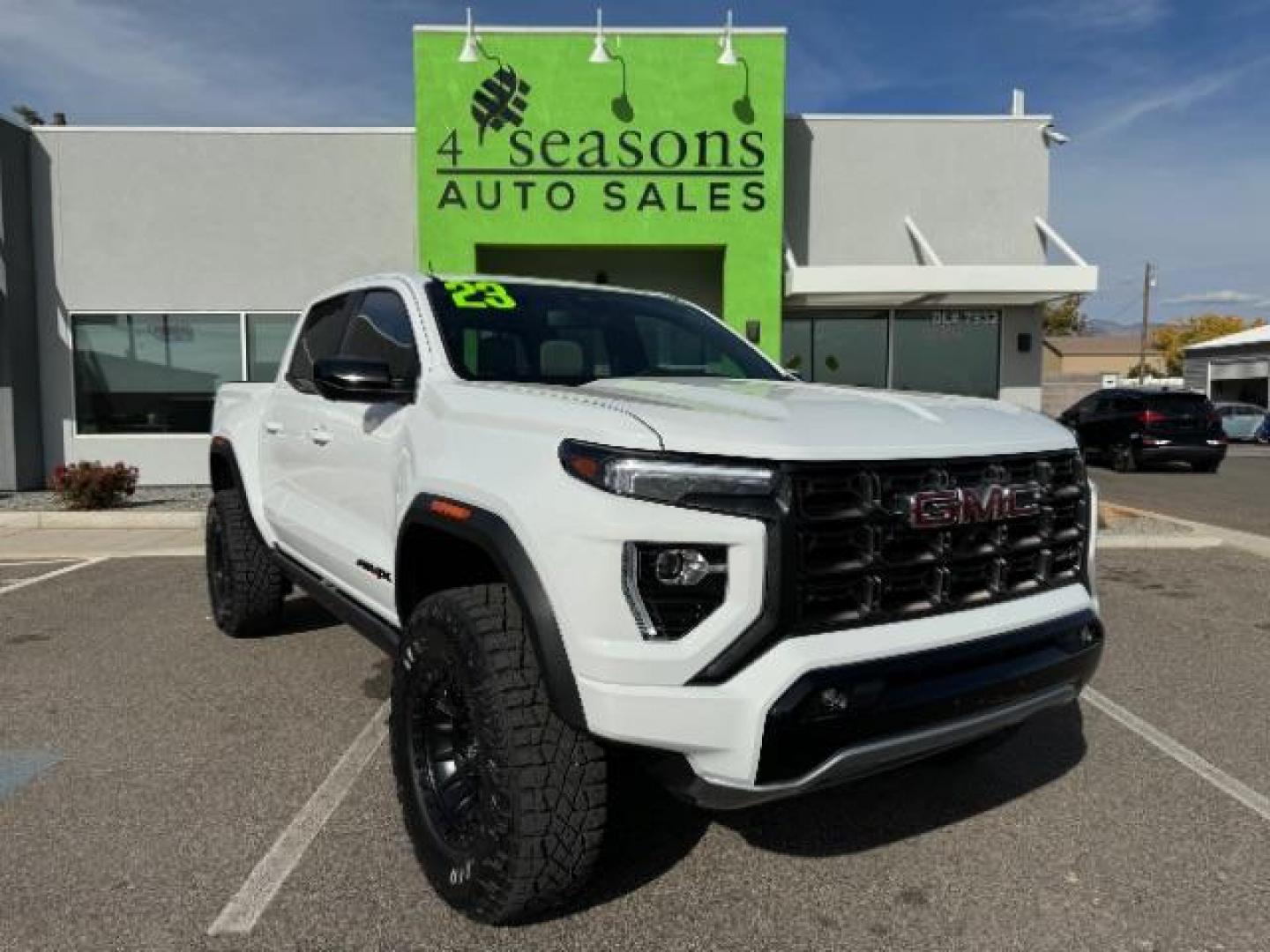 2023 Summit White /Obsidian Rush GMC Canyon AT4X Crew Cab 4WD (1GTP6EEK4P1) with an 2.7L L4 DOHC 16V engine, 6-Speed Automatic transmission, located at 1865 East Red Hills Pkwy, St. George, 84770, (435) 628-0023, 37.120850, -113.543640 - Near new, 1 owner, clear bra, tint, sunroof. Rear truck in mint condition - Photo#0