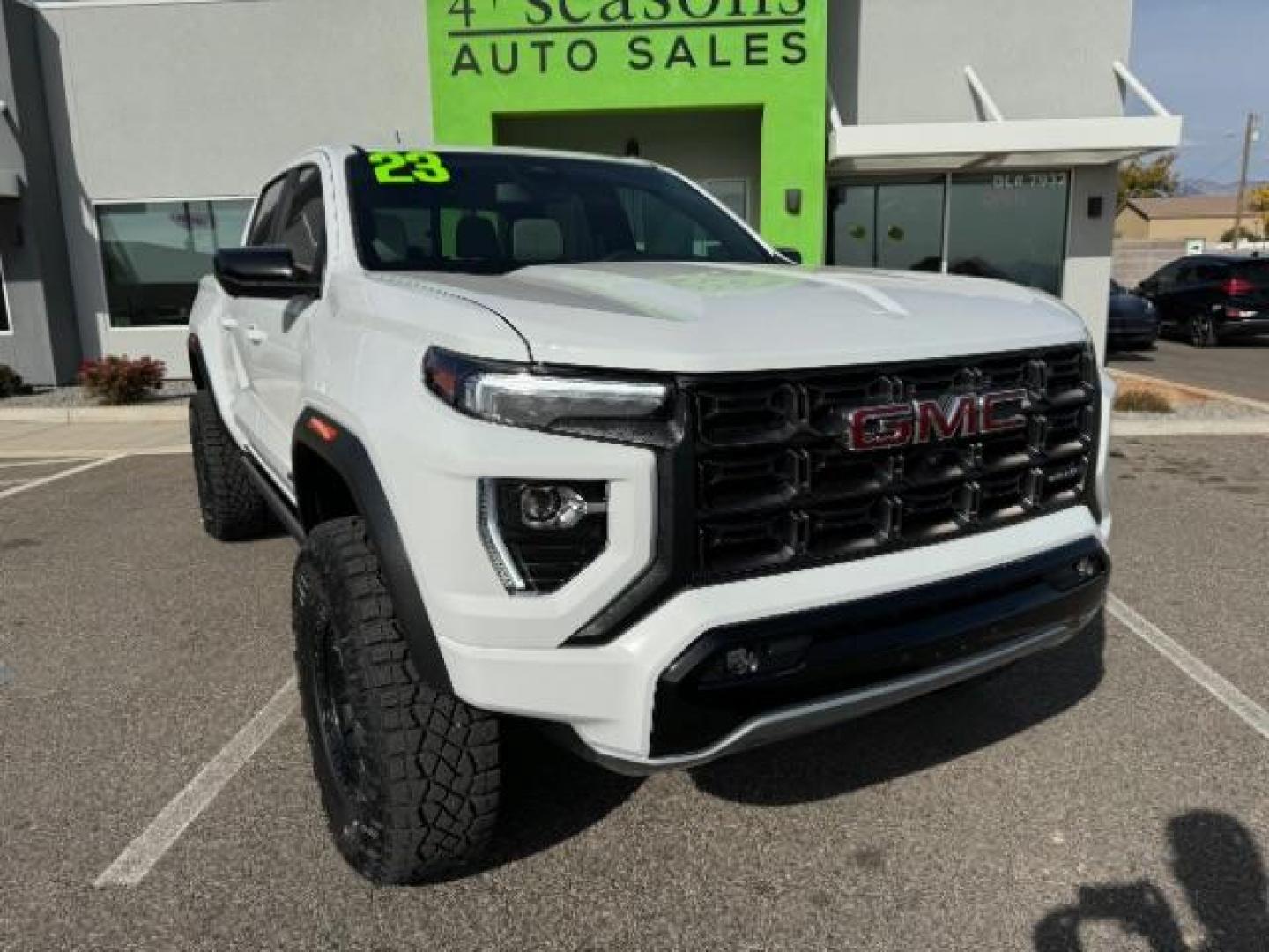 2023 Summit White /Obsidian Rush GMC Canyon AT4X Crew Cab 4WD (1GTP6EEK4P1) with an 2.7L L4 DOHC 16V engine, 6-Speed Automatic transmission, located at 1865 East Red Hills Pkwy, St. George, 84770, (435) 628-0023, 37.120850, -113.543640 - Near new, 1 owner, clear bra, tint, sunroof. Rear truck in mint condition - Photo#1