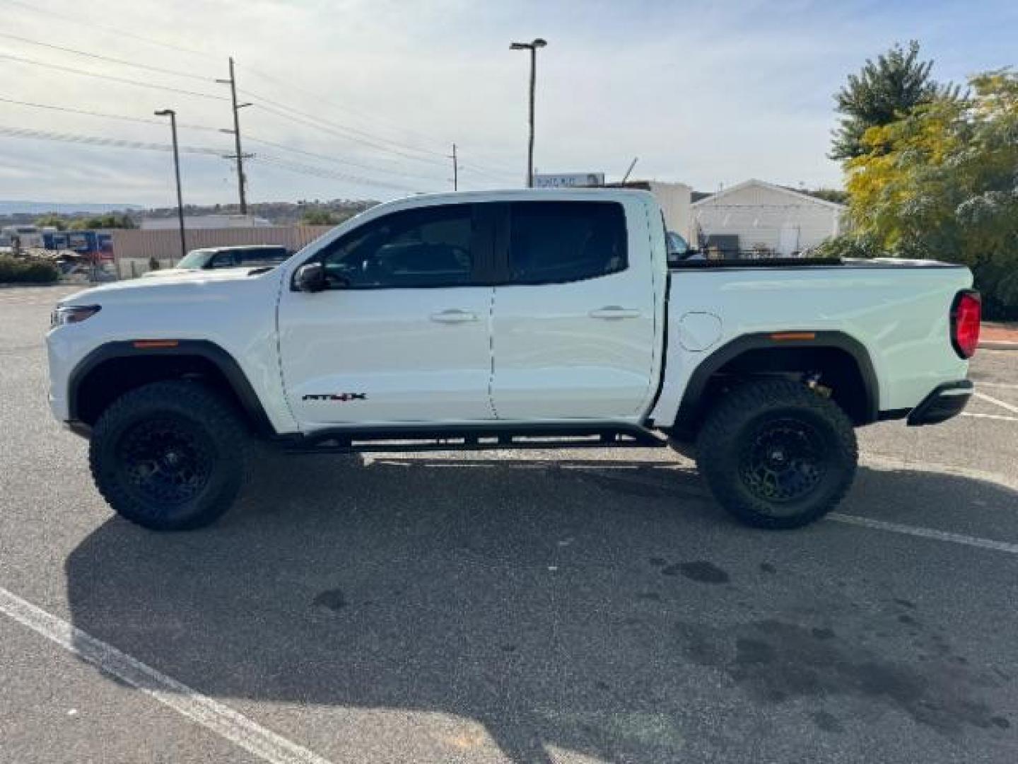 2023 Summit White /Obsidian Rush GMC Canyon AT4X Crew Cab 4WD (1GTP6EEK4P1) with an 2.7L L4 DOHC 16V engine, 6-Speed Automatic transmission, located at 1865 East Red Hills Pkwy, St. George, 84770, (435) 628-0023, 37.120850, -113.543640 - Near new, 1 owner, clear bra, tint, sunroof. Rear truck in mint condition - Photo#5