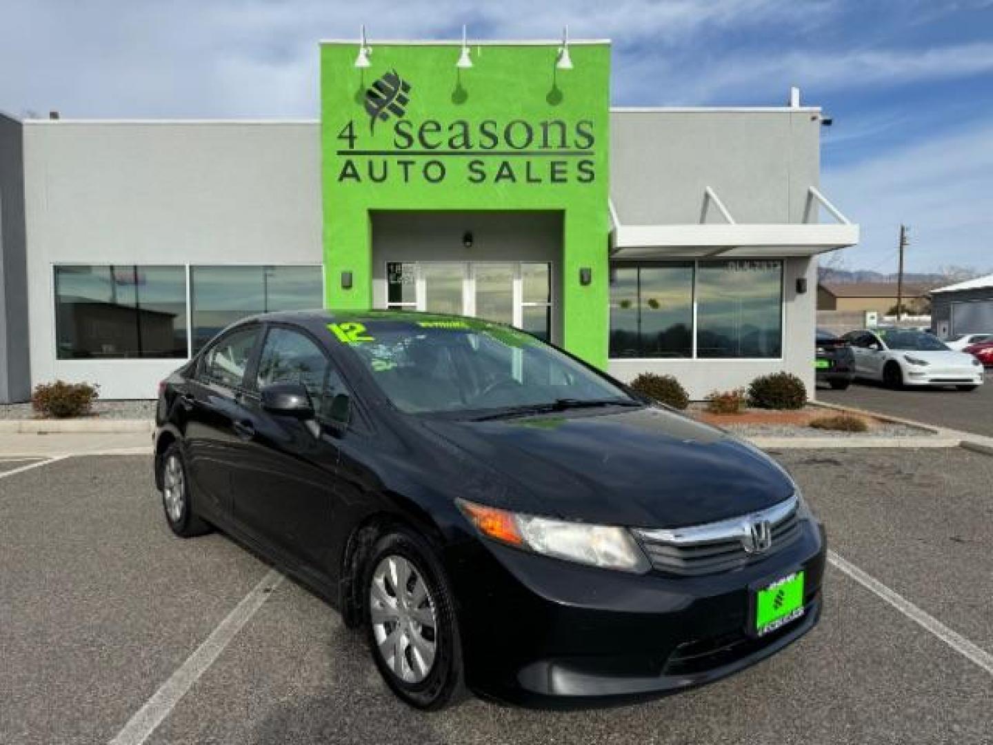 2012 Crystal Black Pearl /Beige Cloth Interior Honda Civic LX Sedan 5-Speed AT (2HGFB2F57CH) with an 1.8L L4 SOHC 16V engine, 5-Speed Automatic transmission, located at 940 North Main Street, Cedar City, UT, 84720, (435) 628-0023, 37.692936, -113.061897 - Photo#0