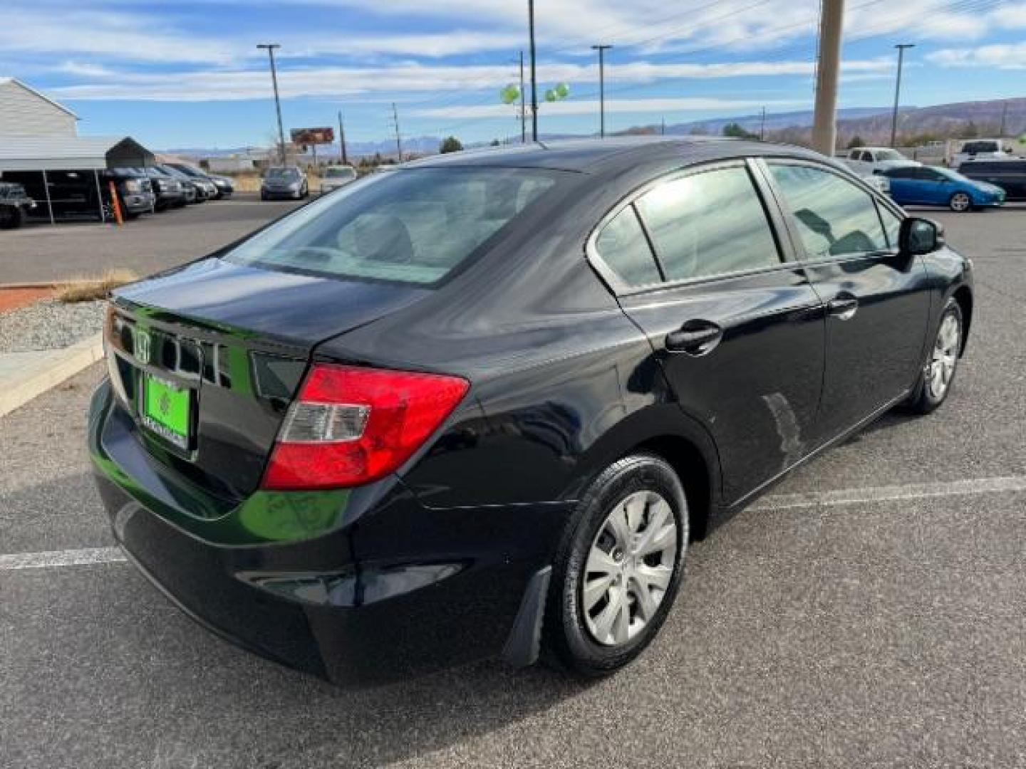 2012 Crystal Black Pearl /Beige Cloth Interior Honda Civic LX Sedan 5-Speed AT (2HGFB2F57CH) with an 1.8L L4 SOHC 16V engine, 5-Speed Automatic transmission, located at 940 North Main Street, Cedar City, UT, 84720, (435) 628-0023, 37.692936, -113.061897 - Photo#9