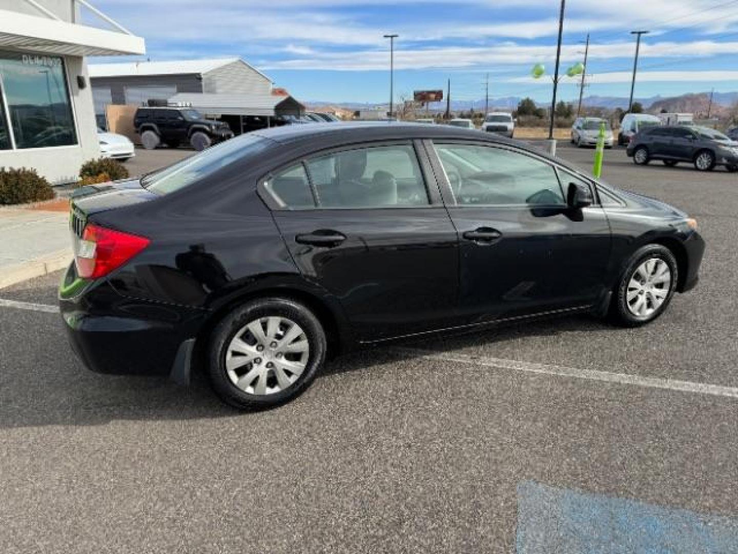 2012 Crystal Black Pearl /Beige Cloth Interior Honda Civic LX Sedan 5-Speed AT (2HGFB2F57CH) with an 1.8L L4 SOHC 16V engine, 5-Speed Automatic transmission, located at 940 North Main Street, Cedar City, UT, 84720, (435) 628-0023, 37.692936, -113.061897 - Photo#10