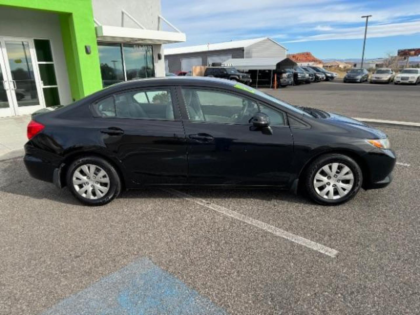 2012 Crystal Black Pearl /Beige Cloth Interior Honda Civic LX Sedan 5-Speed AT (2HGFB2F57CH) with an 1.8L L4 SOHC 16V engine, 5-Speed Automatic transmission, located at 940 North Main Street, Cedar City, UT, 84720, (435) 628-0023, 37.692936, -113.061897 - Photo#11