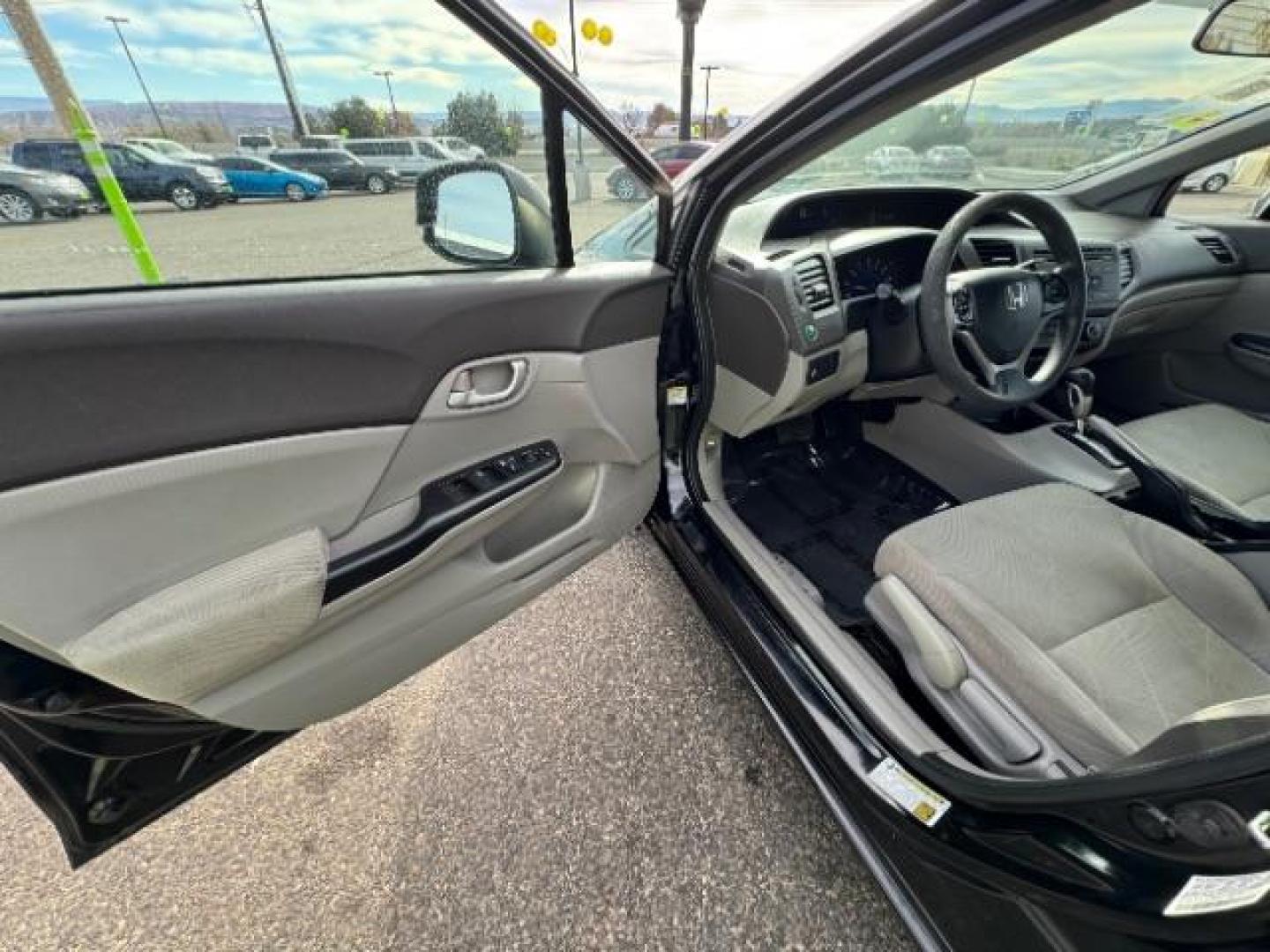 2012 Crystal Black Pearl /Beige Cloth Interior Honda Civic LX Sedan 5-Speed AT (2HGFB2F57CH) with an 1.8L L4 SOHC 16V engine, 5-Speed Automatic transmission, located at 940 North Main Street, Cedar City, UT, 84720, (435) 628-0023, 37.692936, -113.061897 - Photo#16