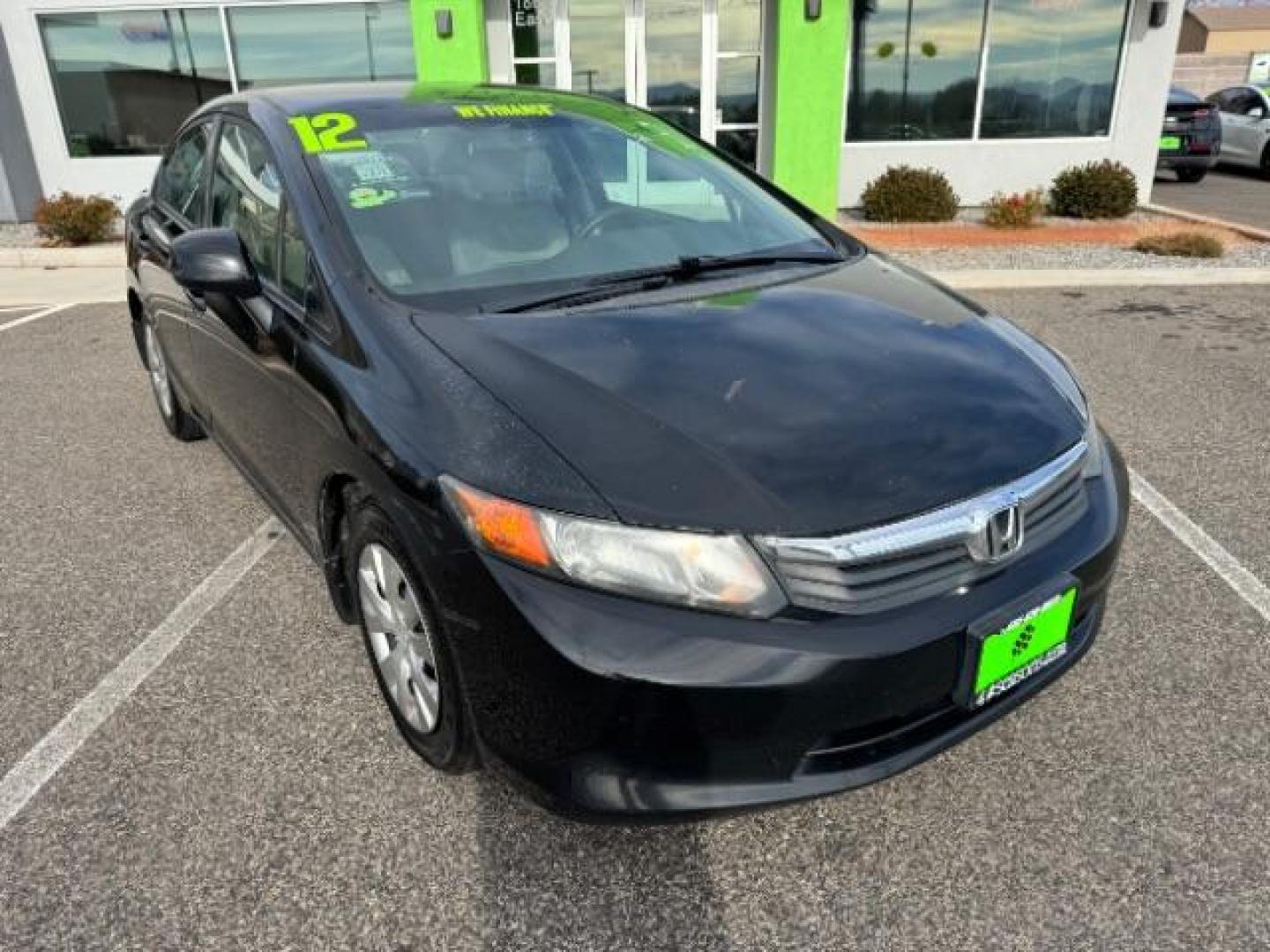 2012 Crystal Black Pearl /Beige Cloth Interior Honda Civic LX Sedan 5-Speed AT (2HGFB2F57CH) with an 1.8L L4 SOHC 16V engine, 5-Speed Automatic transmission, located at 940 North Main Street, Cedar City, UT, 84720, (435) 628-0023, 37.692936, -113.061897 - Photo#1