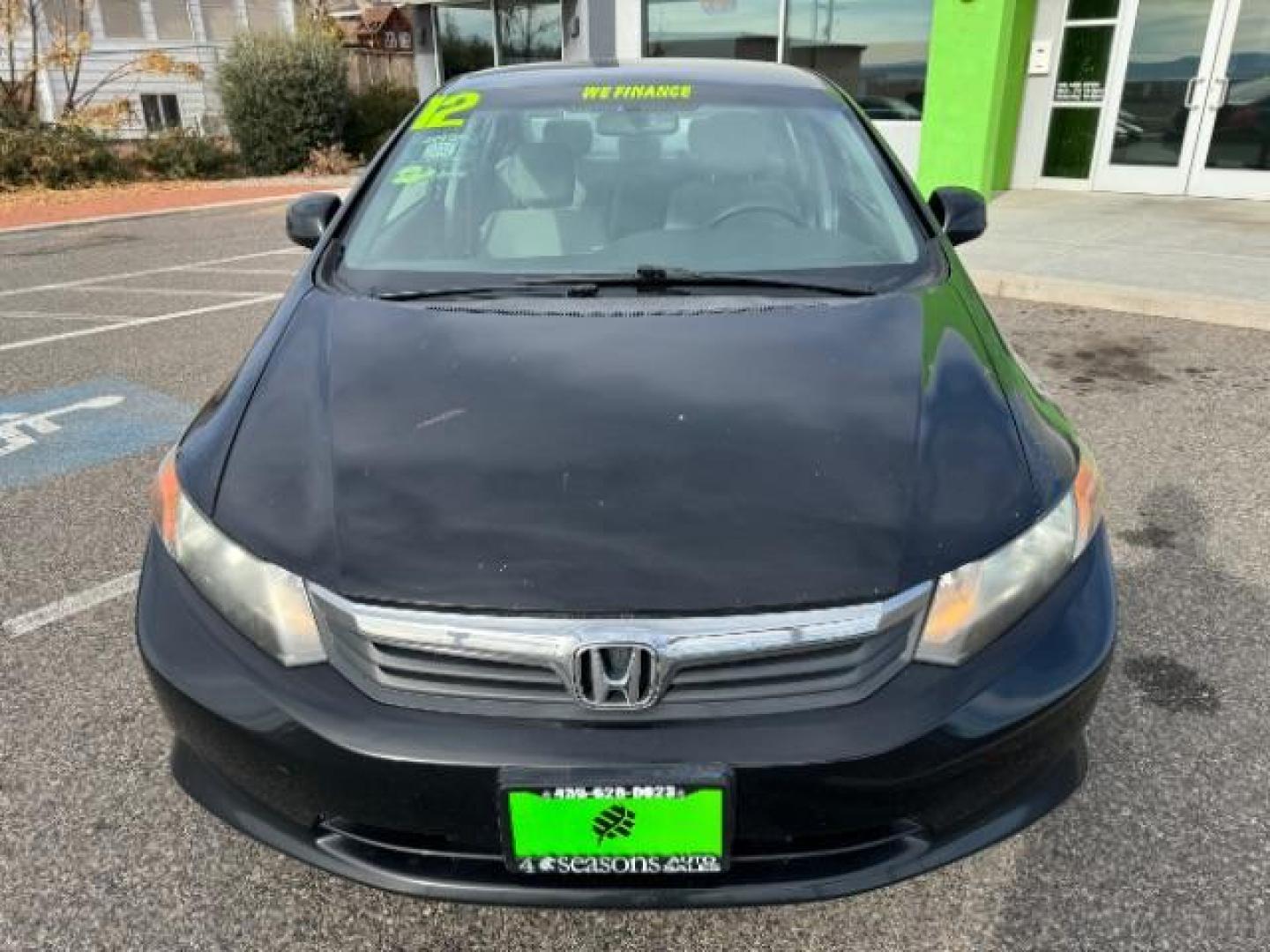 2012 Crystal Black Pearl /Beige Cloth Interior Honda Civic LX Sedan 5-Speed AT (2HGFB2F57CH) with an 1.8L L4 SOHC 16V engine, 5-Speed Automatic transmission, located at 940 North Main Street, Cedar City, UT, 84720, (435) 628-0023, 37.692936, -113.061897 - Photo#2