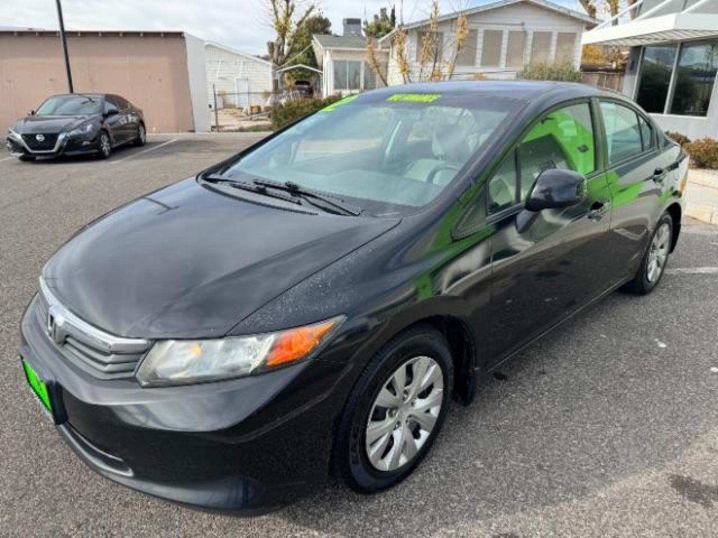 2012 Crystal Black Pearl /Beige Cloth Interior Honda Civic LX Sedan 5-Speed AT (2HGFB2F57CH) with an 1.8L L4 SOHC 16V engine, 5-Speed Automatic transmission, located at 940 North Main Street, Cedar City, UT, 84720, (435) 628-0023, 37.692936, -113.061897 - Photo#3