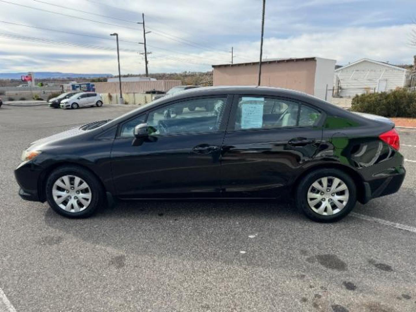 2012 Crystal Black Pearl /Beige Cloth Interior Honda Civic LX Sedan 5-Speed AT (2HGFB2F57CH) with an 1.8L L4 SOHC 16V engine, 5-Speed Automatic transmission, located at 940 North Main Street, Cedar City, UT, 84720, (435) 628-0023, 37.692936, -113.061897 - Photo#5