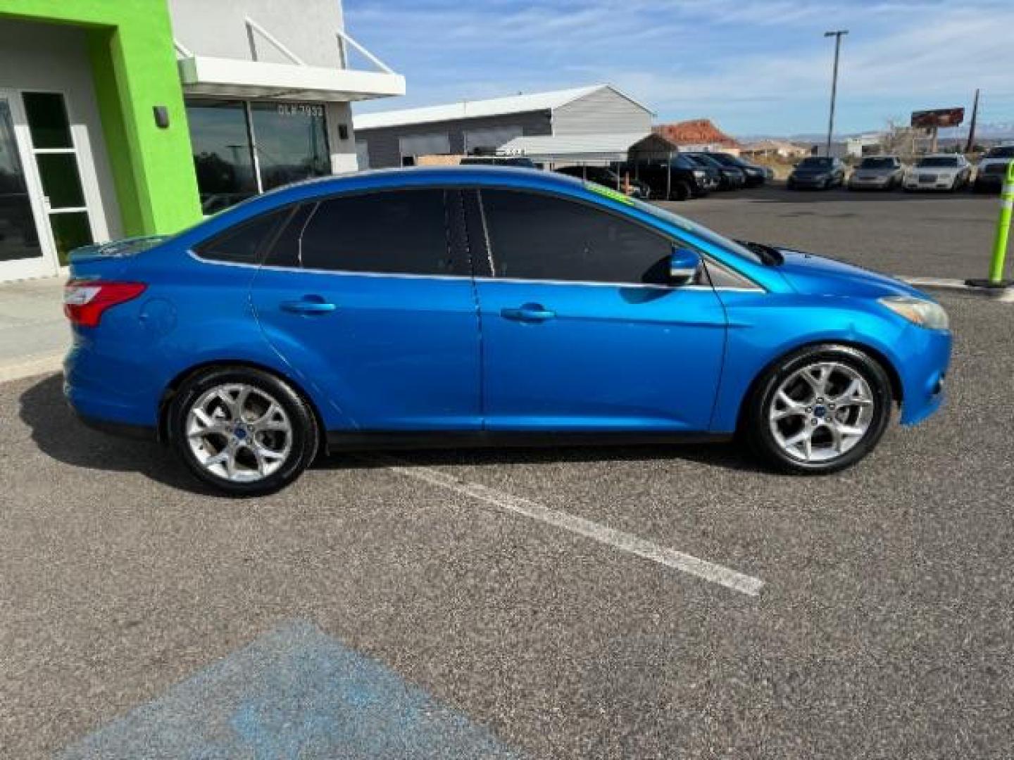 2014 Performance Blue Metallic /Charcoal Black Ford Focus Titanium Sedan (1FADP3J2XEL) with an 2.0L L4 DOHC 16V engine, 6-Speed Automatic transmission, located at 940 North Main Street, Cedar City, UT, 84720, (435) 628-0023, 37.692936, -113.061897 - Photo#9