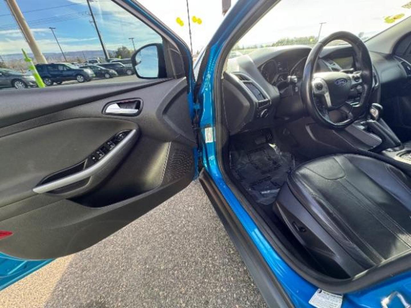 2014 Performance Blue Metallic /Charcoal Black Ford Focus Titanium Sedan (1FADP3J2XEL) with an 2.0L L4 DOHC 16V engine, 6-Speed Automatic transmission, located at 940 North Main Street, Cedar City, UT, 84720, (435) 628-0023, 37.692936, -113.061897 - Photo#14