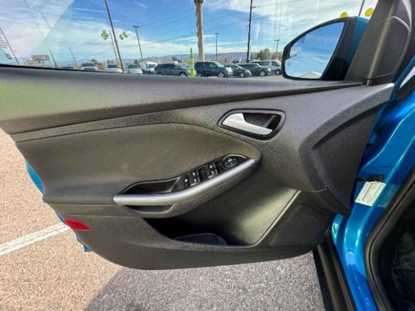 2014 Performance Blue Metallic /Charcoal Black Ford Focus Titanium Sedan (1FADP3J2XEL) with an 2.0L L4 DOHC 16V engine, 6-Speed Automatic transmission, located at 940 North Main Street, Cedar City, UT, 84720, (435) 628-0023, 37.692936, -113.061897 - Photo#15