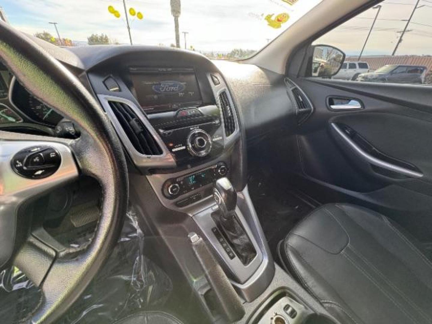 2014 Performance Blue Metallic /Charcoal Black Ford Focus Titanium Sedan (1FADP3J2XEL) with an 2.0L L4 DOHC 16V engine, 6-Speed Automatic transmission, located at 940 North Main Street, Cedar City, UT, 84720, (435) 628-0023, 37.692936, -113.061897 - Photo#17