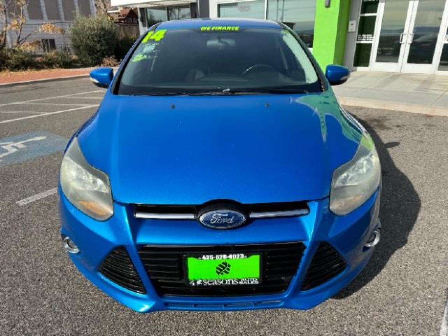 2014 Performance Blue Metallic /Charcoal Black Ford Focus Titanium Sedan (1FADP3J2XEL) with an 2.0L L4 DOHC 16V engine, 6-Speed Automatic transmission, located at 940 North Main Street, Cedar City, UT, 84720, (435) 628-0023, 37.692936, -113.061897 - Photo#2