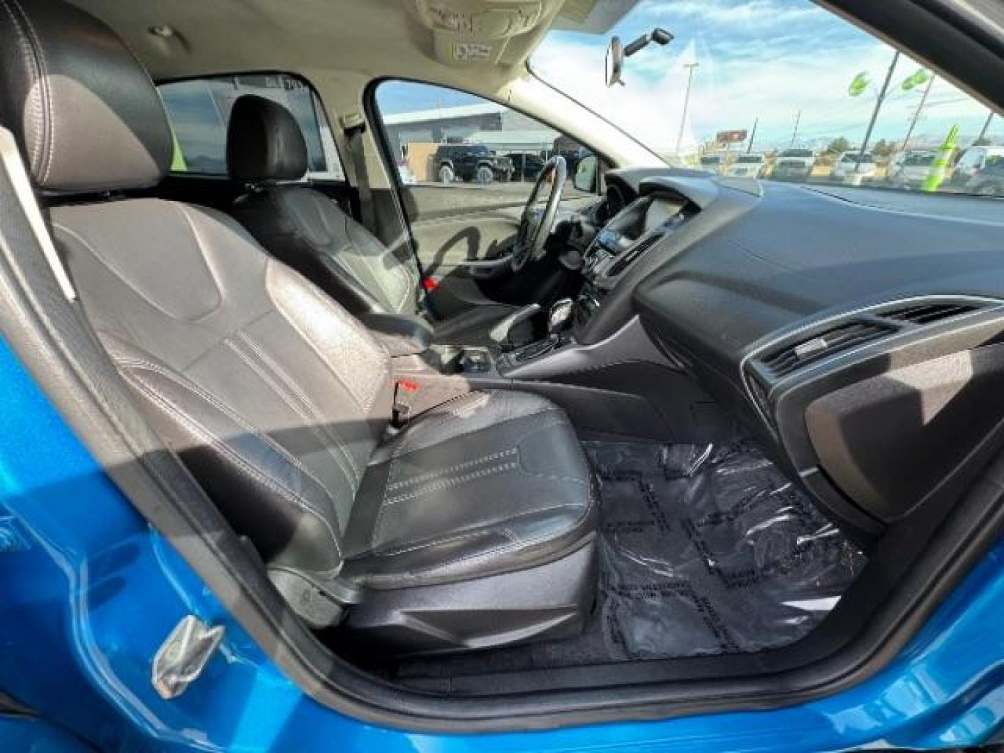 2014 Performance Blue Metallic /Charcoal Black Ford Focus Titanium Sedan (1FADP3J2XEL) with an 2.0L L4 DOHC 16V engine, 6-Speed Automatic transmission, located at 940 North Main Street, Cedar City, UT, 84720, (435) 628-0023, 37.692936, -113.061897 - Photo#34