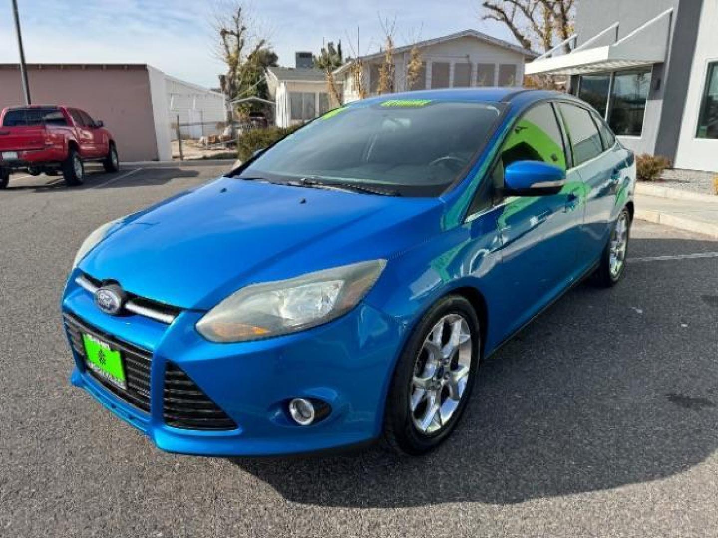 2014 Performance Blue Metallic /Charcoal Black Ford Focus Titanium Sedan (1FADP3J2XEL) with an 2.0L L4 DOHC 16V engine, 6-Speed Automatic transmission, located at 940 North Main Street, Cedar City, UT, 84720, (435) 628-0023, 37.692936, -113.061897 - Photo#3