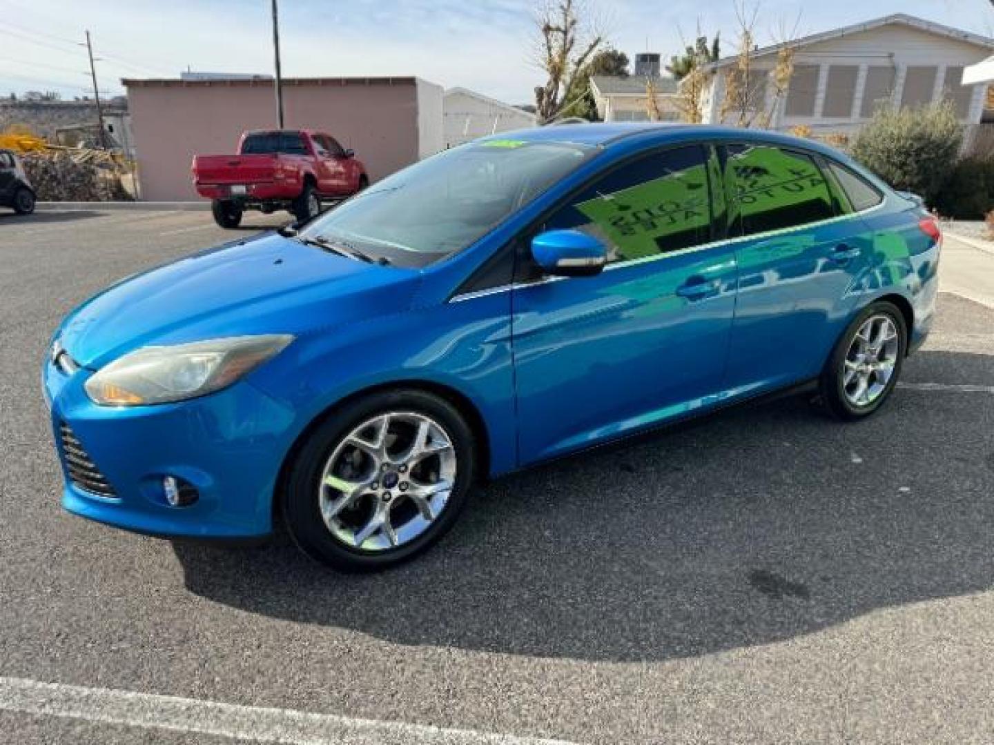 2014 Performance Blue Metallic /Charcoal Black Ford Focus Titanium Sedan (1FADP3J2XEL) with an 2.0L L4 DOHC 16V engine, 6-Speed Automatic transmission, located at 940 North Main Street, Cedar City, UT, 84720, (435) 628-0023, 37.692936, -113.061897 - Photo#4