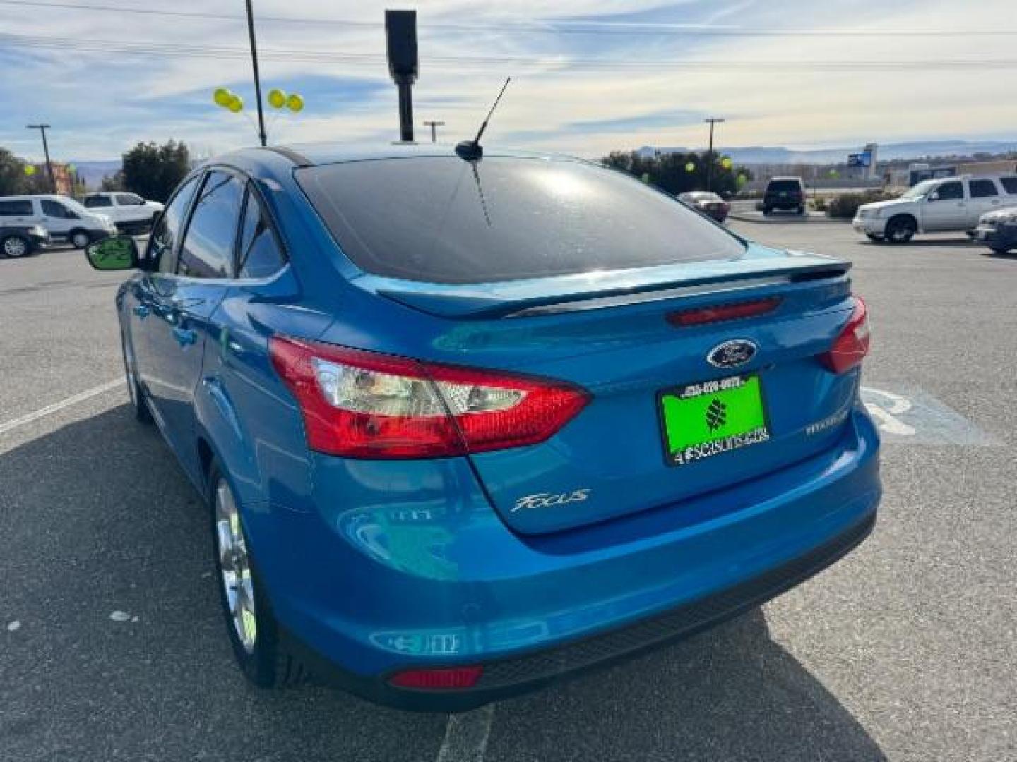 2014 Performance Blue Metallic /Charcoal Black Ford Focus Titanium Sedan (1FADP3J2XEL) with an 2.0L L4 DOHC 16V engine, 6-Speed Automatic transmission, located at 940 North Main Street, Cedar City, UT, 84720, (435) 628-0023, 37.692936, -113.061897 - Photo#6