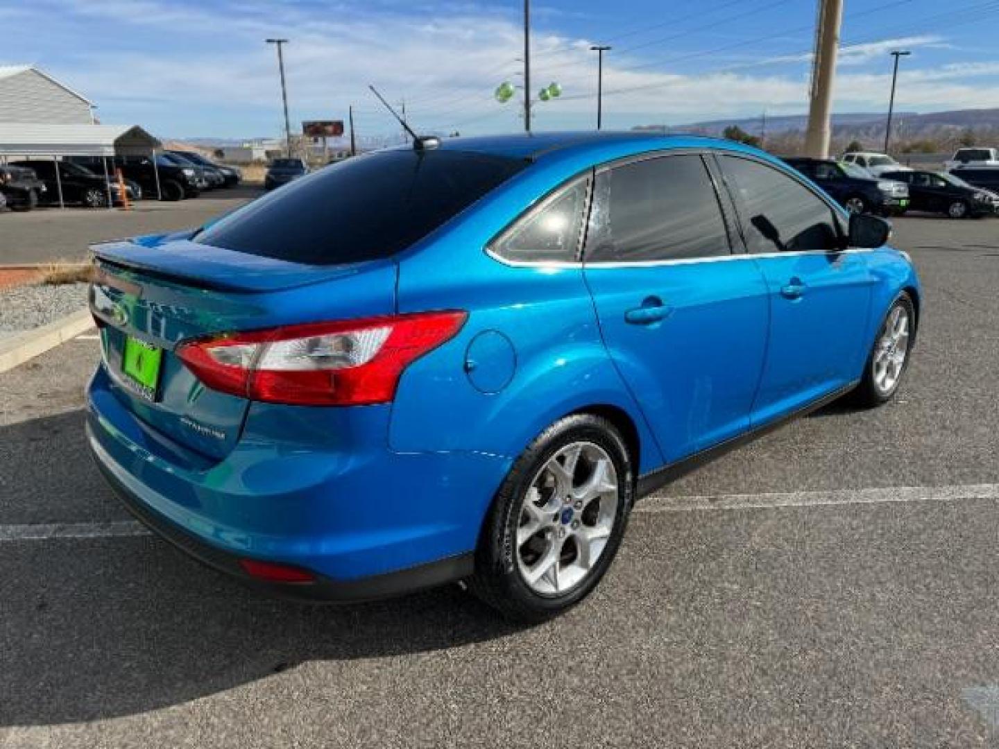 2014 Performance Blue Metallic /Charcoal Black Ford Focus Titanium Sedan (1FADP3J2XEL) with an 2.0L L4 DOHC 16V engine, 6-Speed Automatic transmission, located at 940 North Main Street, Cedar City, UT, 84720, (435) 628-0023, 37.692936, -113.061897 - Photo#8