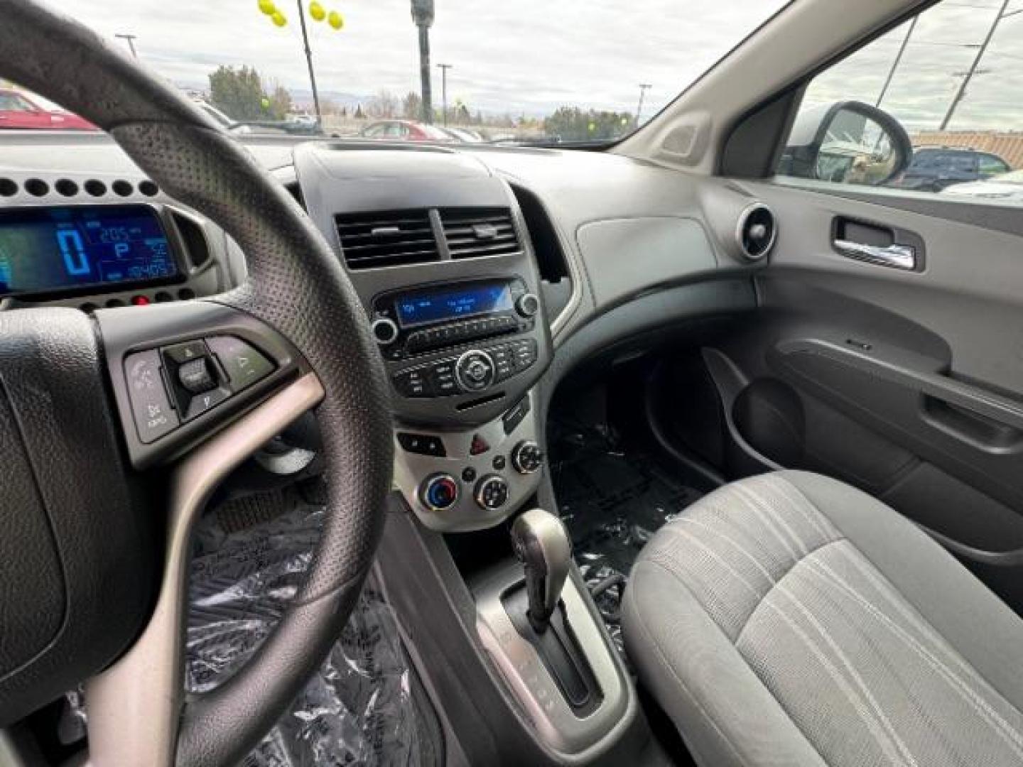 2014 Silver Ice Metallic /Dark Pewter/Dark Titanium Chevrolet Sonic LT Auto 5-Door (1G1JC6SH0E4) with an 1.8L L4 DOHC 24V engine, 6-Speed Automatic transmission, located at 1865 East Red Hills Pkwy, St. George, 84770, (435) 628-0023, 37.120850, -113.543640 - Photo#19