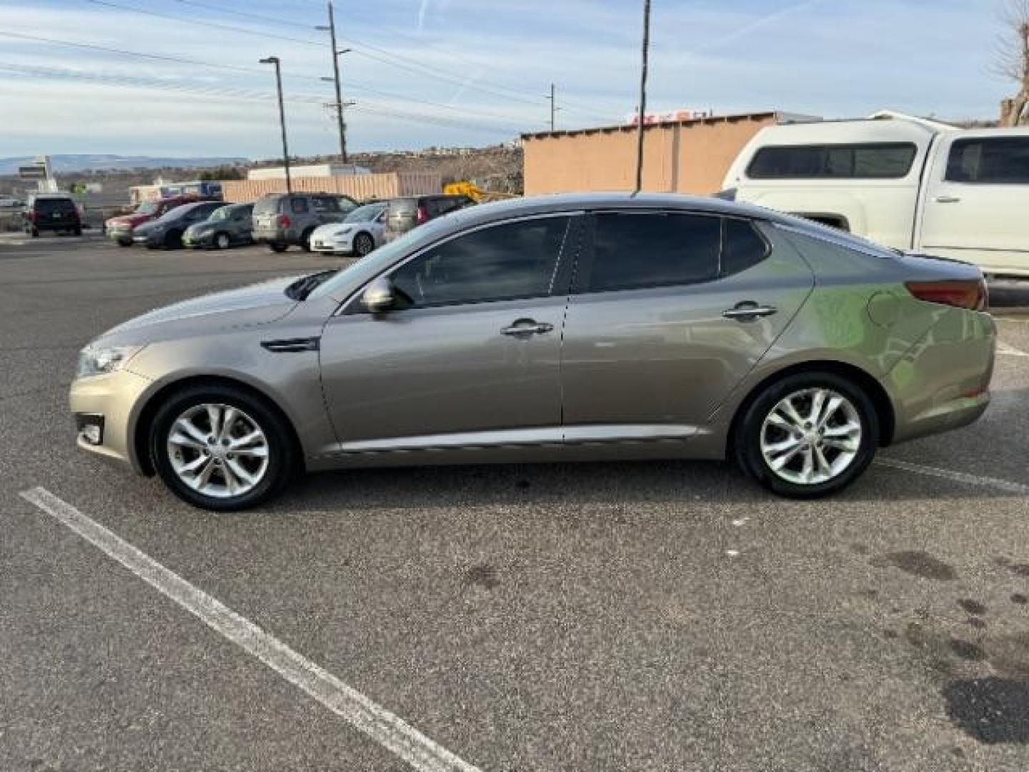 2013 Metal Bronze Pearl Metallic /Beige Leather Interior Kia Optima EX (5XXGN4A72DG) with an 2.4L L4 DOHC 16V engine, 6-Speed Automatic transmission, located at 1865 East Red Hills Pkwy, St. George, 84770, (435) 628-0023, 37.120850, -113.543640 - We specialize in helping ALL people get the best financing available. No matter your credit score, good, bad or none we can get you an amazing rate. Had a bankruptcy, divorce, or repossessions? We give you the green light to get your credit back on the road. Low down and affordable payments that fit - Photo#5