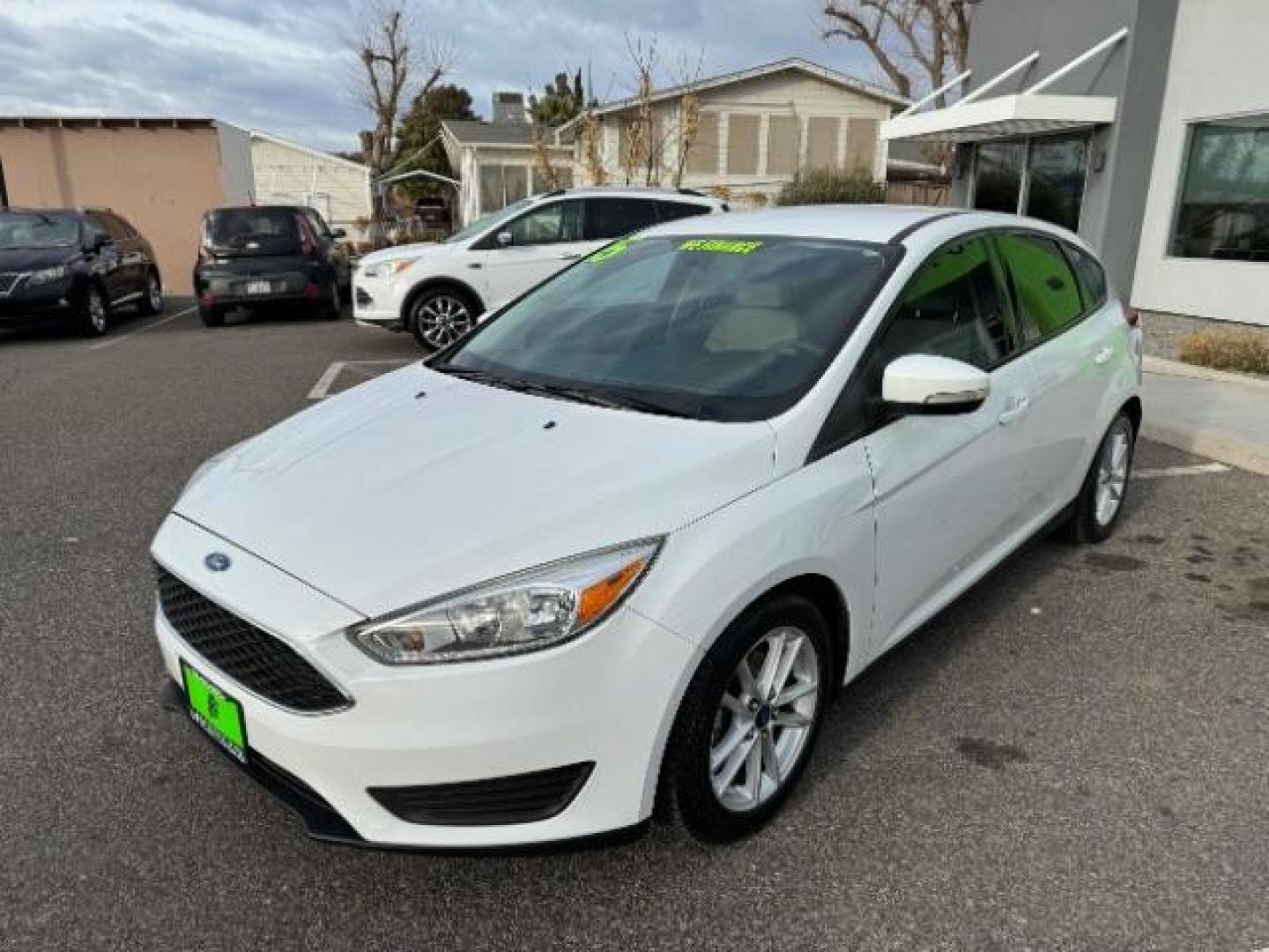 2015 Oxford White /Charcoal Black, leather Ford Focus SE Hatch (1FADP3K25FL) with an 2.0L L4 DOHC 16V engine, 5-Speed Manual transmission, located at 940 North Main Street, Cedar City, UT, 84720, (435) 628-0023, 37.692936, -113.061897 - We specialize in helping ALL people get the best financing available. No matter your credit score, good, bad or none we can get you an amazing rate. Had a bankruptcy, divorce, or repossessions? We give you the green light to get your credit back on the road. Low down and affordable payments that fit - Photo#3