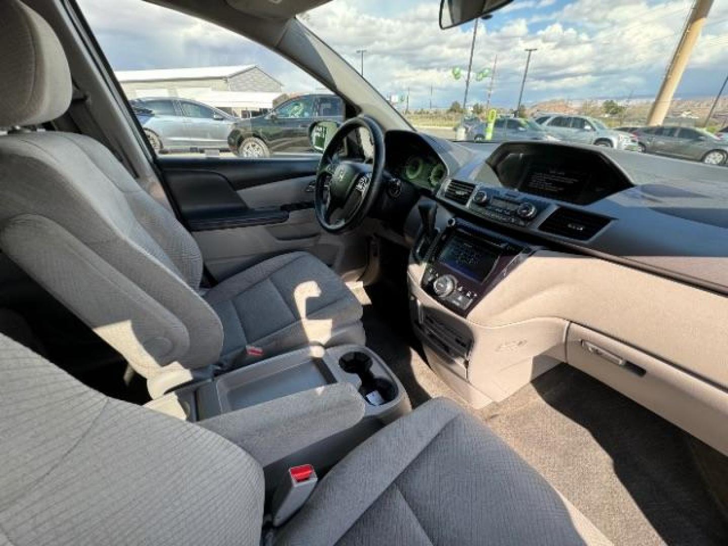 2016 Lunar Silver Metallic /Gray, cloth Honda Odyssey SE (5FNRL5H30GB) with an 3.5L V6 SOHC 24V engine, 6-Speed Automatic transmission, located at 940 North Main Street, Cedar City, UT, 84720, (435) 628-0023, 37.692936, -113.061897 - Photo#36