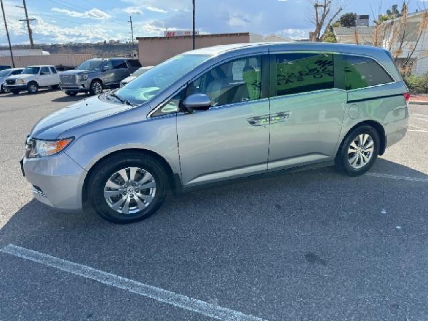 2016 Lunar Silver Metallic /Gray, cloth Honda Odyssey SE (5FNRL5H30GB) with an 3.5L V6 SOHC 24V engine, 6-Speed Automatic transmission, located at 940 North Main Street, Cedar City, UT, 84720, (435) 628-0023, 37.692936, -113.061897 - Photo#4