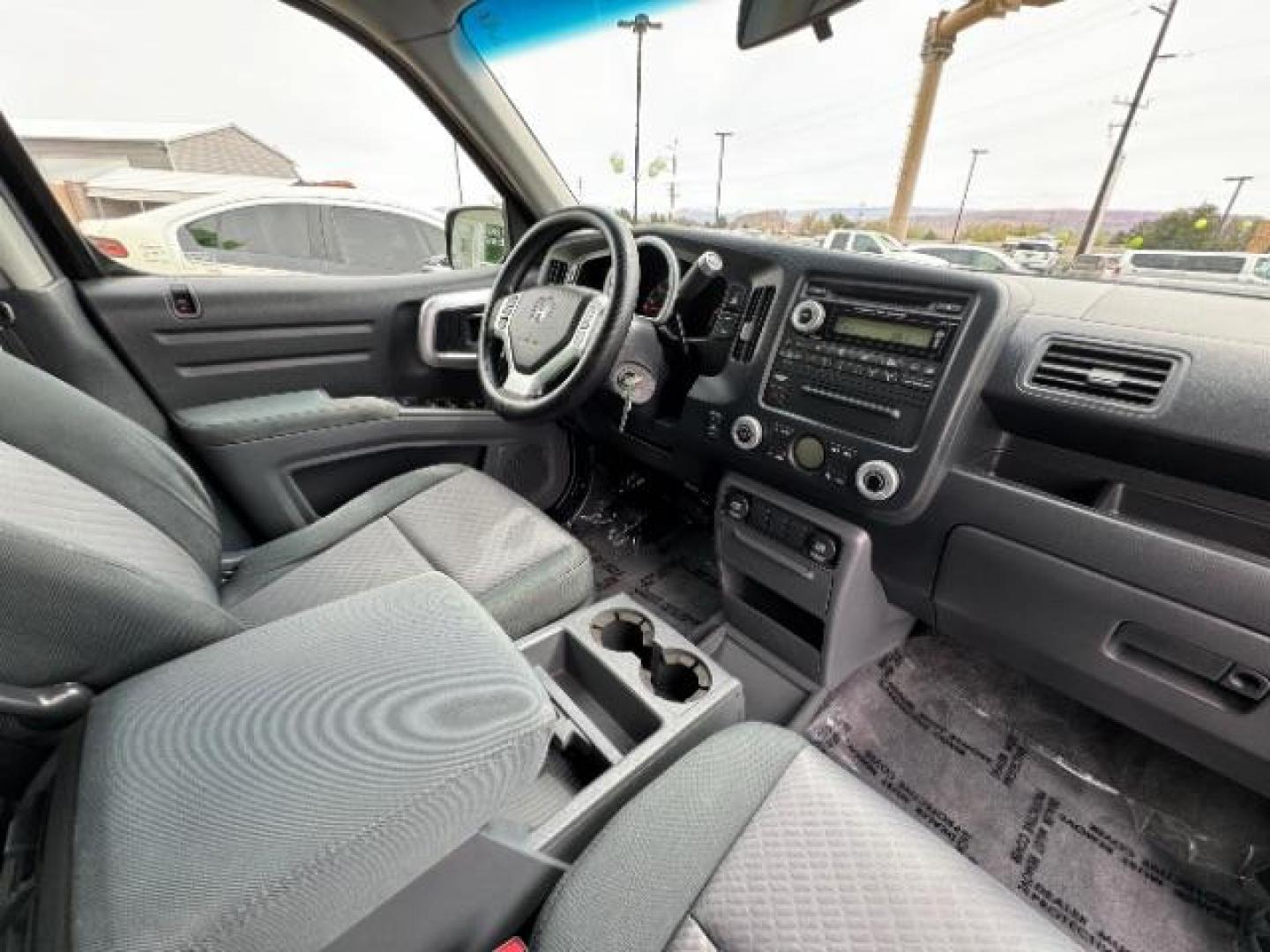 2007 Formal Black /Gray Cloth Interior Honda Ridgeline RTS (2HJYK16477H) with an 3.5L V6 SOHC 24V engine, 5-Speed Automatic transmission, located at 940 North Main Street, Cedar City, UT, 84720, (435) 628-0023, 37.692936, -113.061897 - We specialize in helping ALL people get the best financing available. No matter your credit score, good, bad or none we can get you an amazing rate. Had a bankruptcy, divorce, or repossessions? We give you the green light to get your credit back on the road. Low down and affordable payments that fit - Photo#32