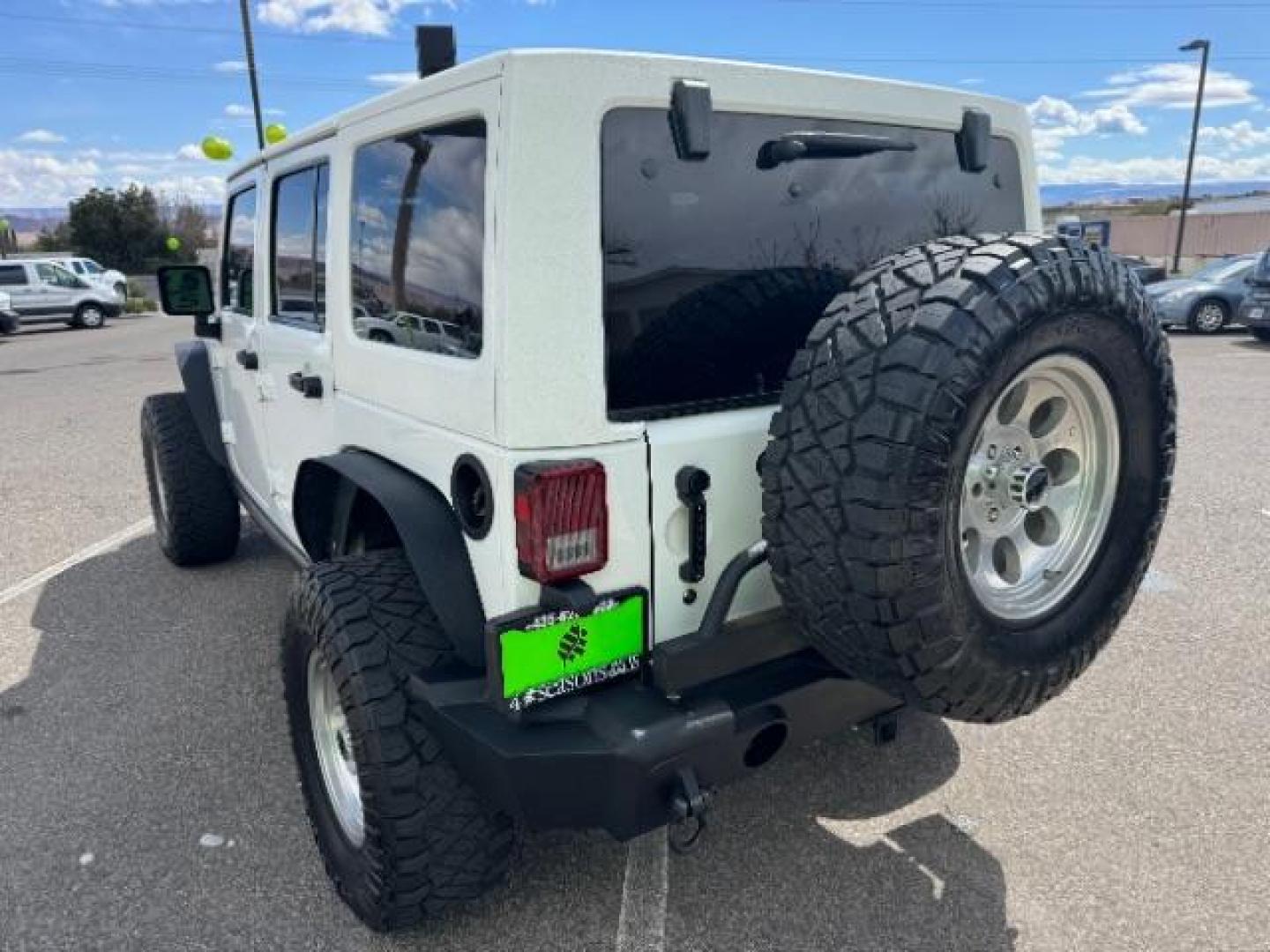 2014 Bright White Clearcoat /Black Jeep Wrangler Unlimited Rubicon 4WD (1C4BJWFG3EL) with an 3.6L V6 DOHC 24V FFV engine, 5-Speed Automatic transmission, located at 1865 East Red Hills Pkwy, St. George, 84770, (435) 628-0023, 37.120850, -113.543640 - Photo#7