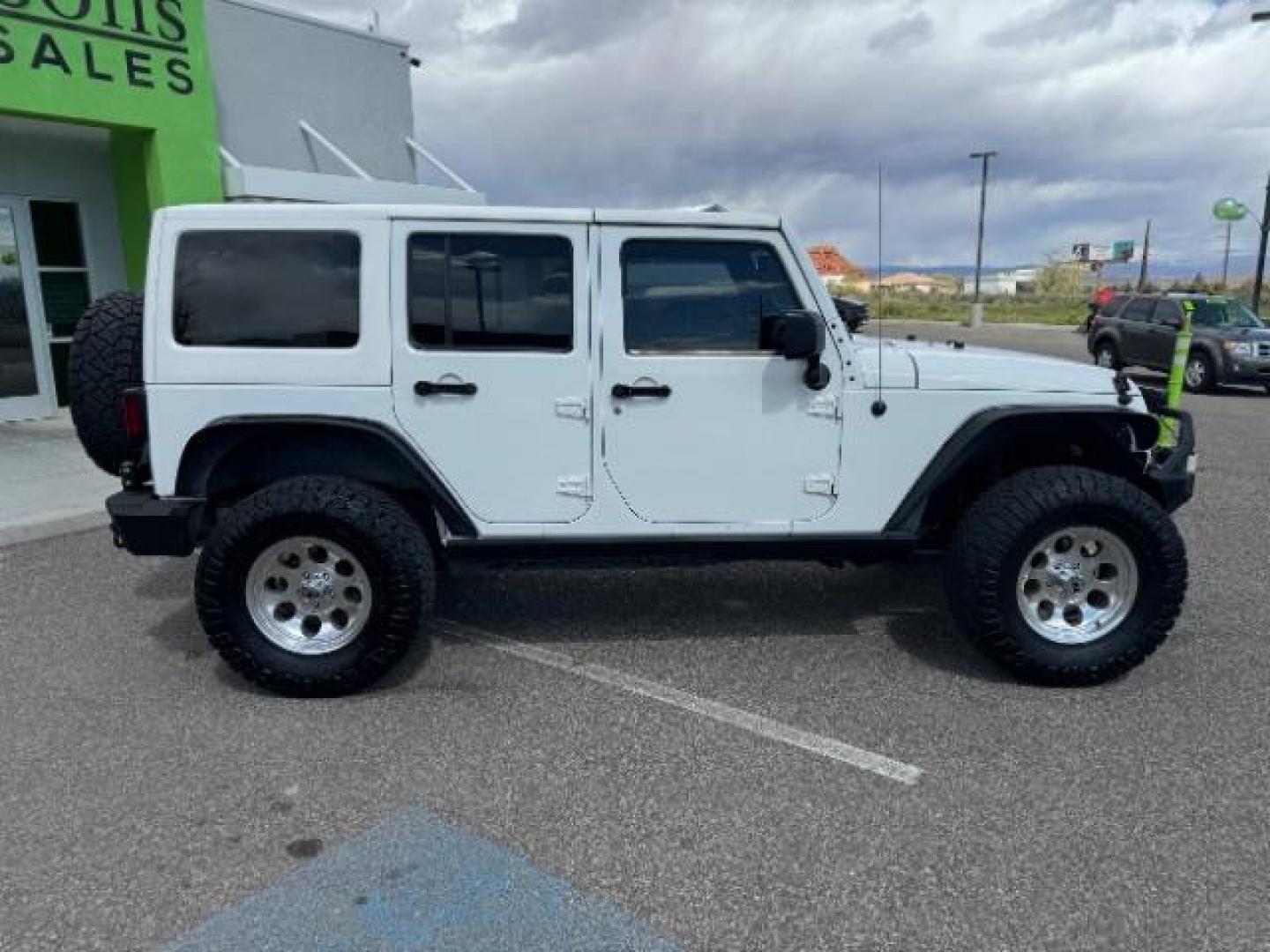 2014 Bright White Clearcoat /Black Jeep Wrangler Unlimited Rubicon 4WD (1C4BJWFG3EL) with an 3.6L V6 DOHC 24V FFV engine, 5-Speed Automatic transmission, located at 1865 East Red Hills Pkwy, St. George, 84770, (435) 628-0023, 37.120850, -113.543640 - Photo#11