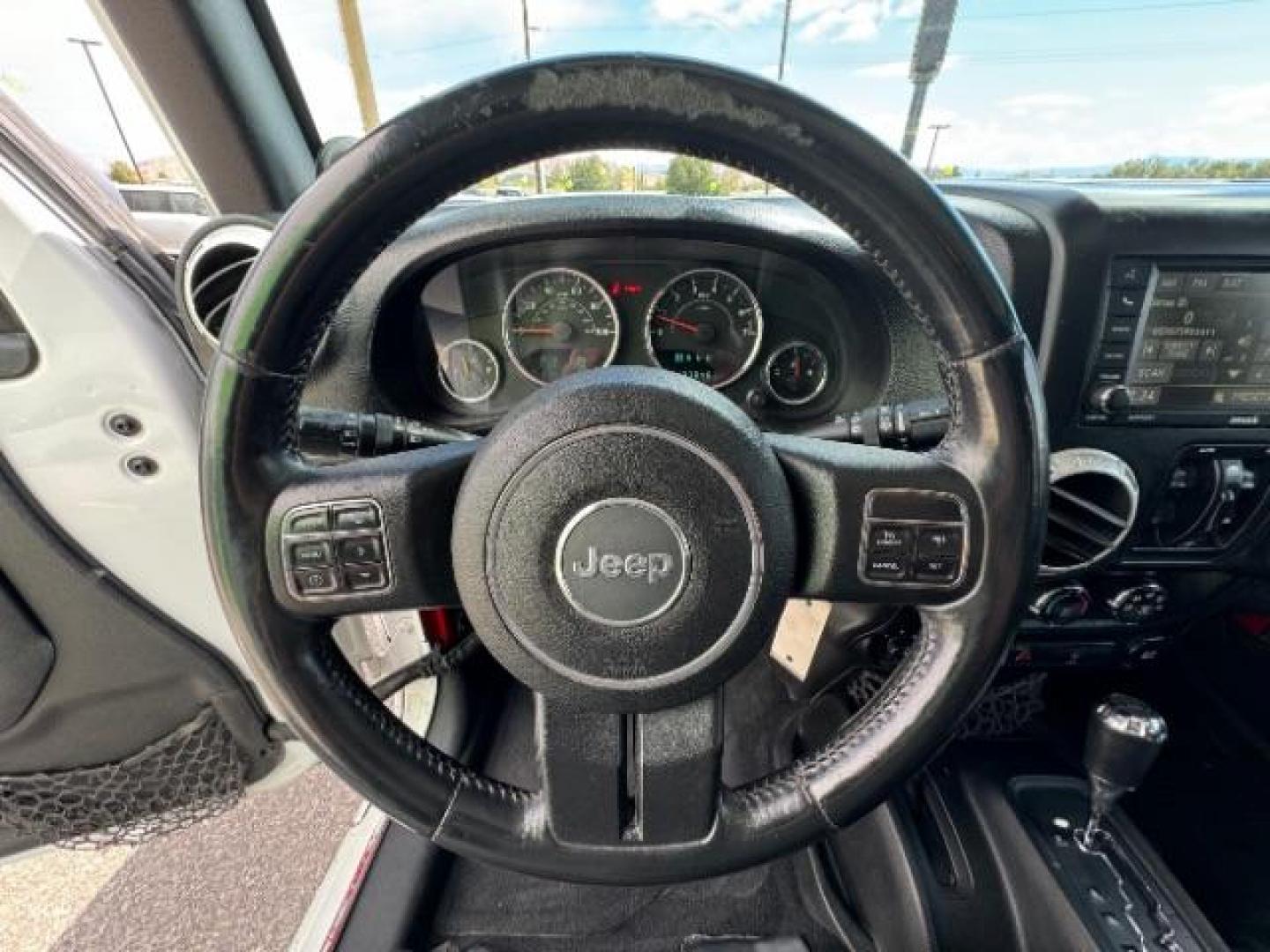 2014 Bright White Clearcoat /Black Jeep Wrangler Unlimited Rubicon 4WD (1C4BJWFG3EL) with an 3.6L V6 DOHC 24V FFV engine, 5-Speed Automatic transmission, located at 1865 East Red Hills Pkwy, St. George, 84770, (435) 628-0023, 37.120850, -113.543640 - Photo#20