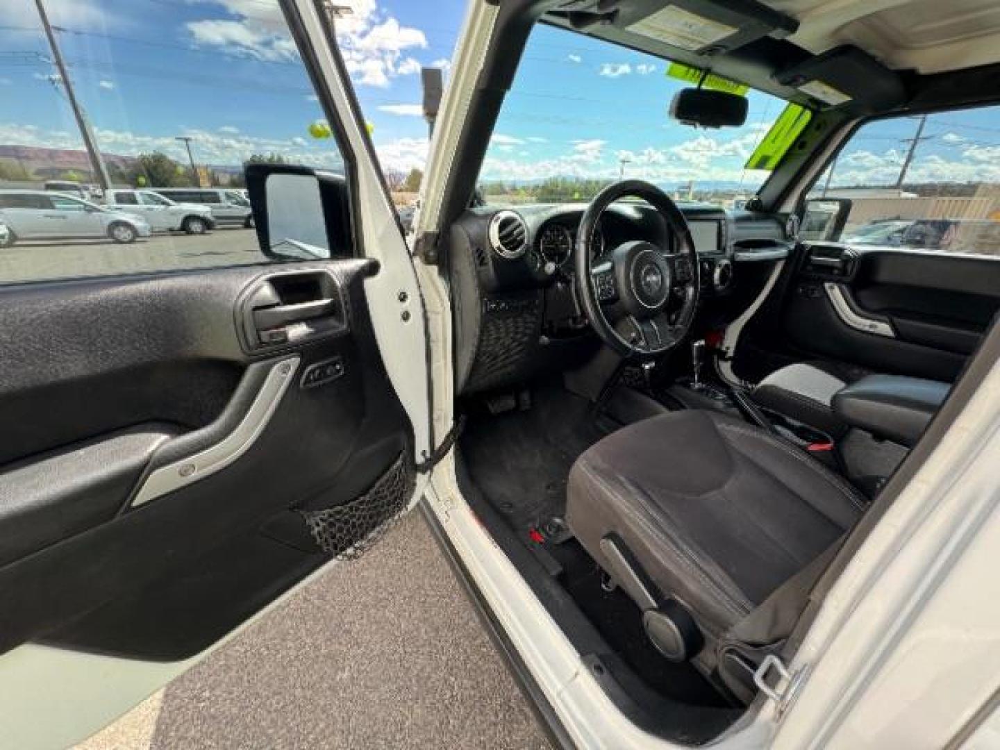 2014 Bright White Clearcoat /Black Jeep Wrangler Unlimited Rubicon 4WD (1C4BJWFG3EL) with an 3.6L V6 DOHC 24V FFV engine, 5-Speed Automatic transmission, located at 1865 East Red Hills Pkwy, St. George, 84770, (435) 628-0023, 37.120850, -113.543640 - Photo#16