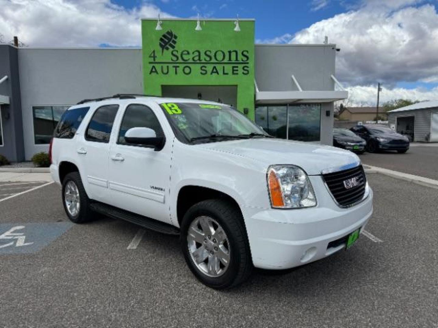 2013 Summit White /Light Tan Leather Interior GMC Yukon SLT 4WD (1GKS2CE09DR) with an 5.3L V8 OHV 16V FFV engine, 6-Speed Automatic transmission, located at 1865 East Red Hills Pkwy, St. George, 84770, (435) 628-0023, 37.120850, -113.543640 - Photo#0