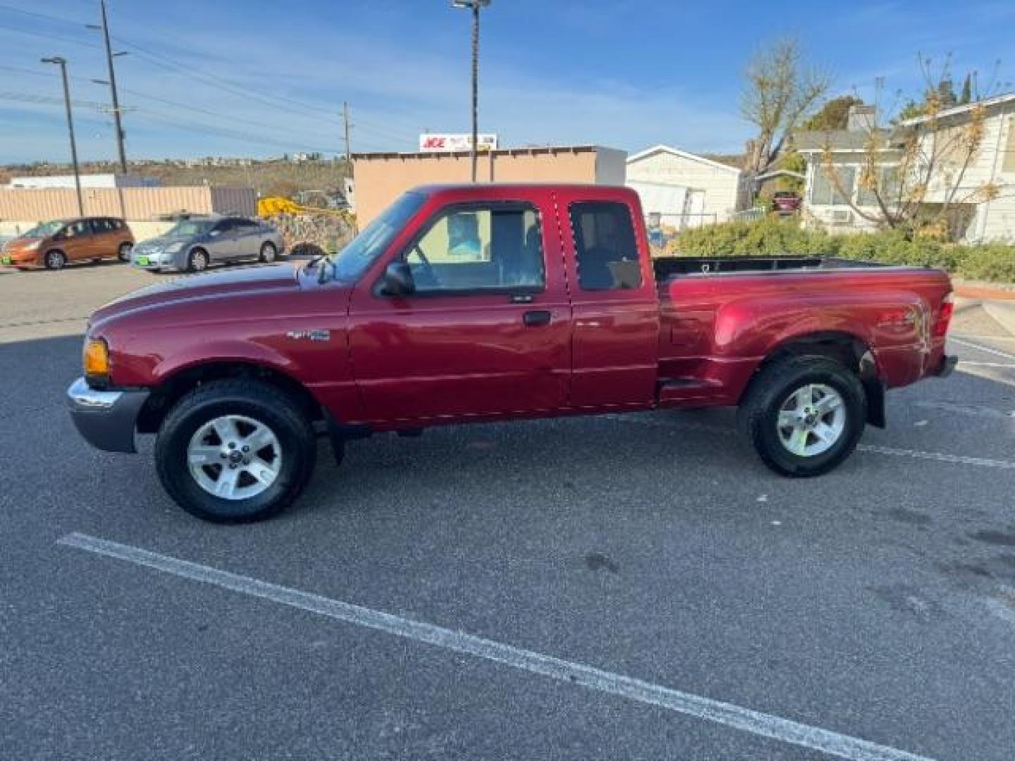 2003 MAROON /Dark Graphite Cloth Interior Ford Ranger XLT SuperCab 4WD - 389A (1FTZR45E53P) with an 4.0L V6 SOHC 12V engine, located at 940 North Main Street, Cedar City, UT, 84720, (435) 628-0023, 37.692936, -113.061897 - Photo#5