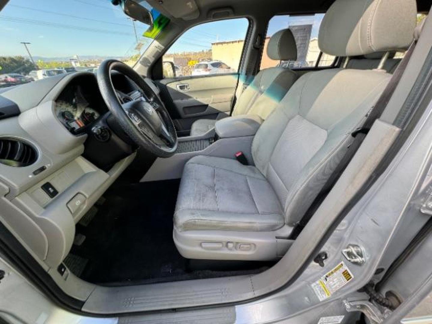 2012 Alabaster Silver Metallic /Gray Cloth Interior Honda Pilot EX 4WD 5-Spd AT (5FNYF4H40CB) with an 3.5L V6 SOHC 24V engine, 5-Speed Automatic transmission, located at 940 North Main Street, Cedar City, UT, 84720, (435) 628-0023, 37.692936, -113.061897 - We specialize in helping ALL people get the best financing available. No matter your credit score, good, bad or none we can get you an amazing rate. Had a bankruptcy, divorce, or repossessions? We give you the green light to get your credit back on the road. Low down and affordable payments that fit - Photo#17