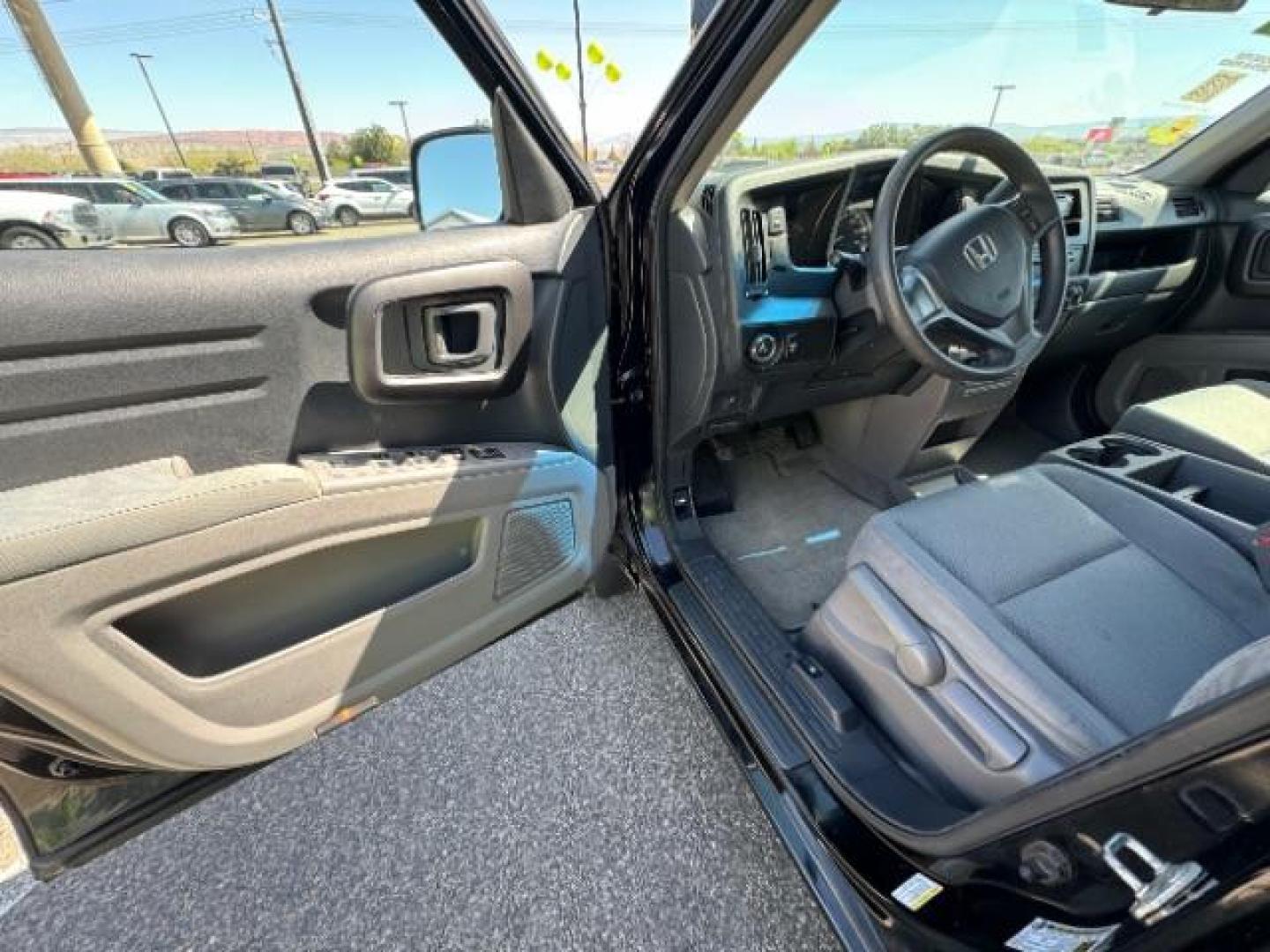 2010 Crystal Black Pearl /Beige Cloth Interior Honda Ridgeline RT (5FPYK1F23AB) with an 3.5L V6 SOHC 24V engine, 5-Speed Automatic transmission, located at 1865 East Red Hills Pkwy, St. George, 84770, (435) 628-0023, 37.120850, -113.543640 - Photo#16