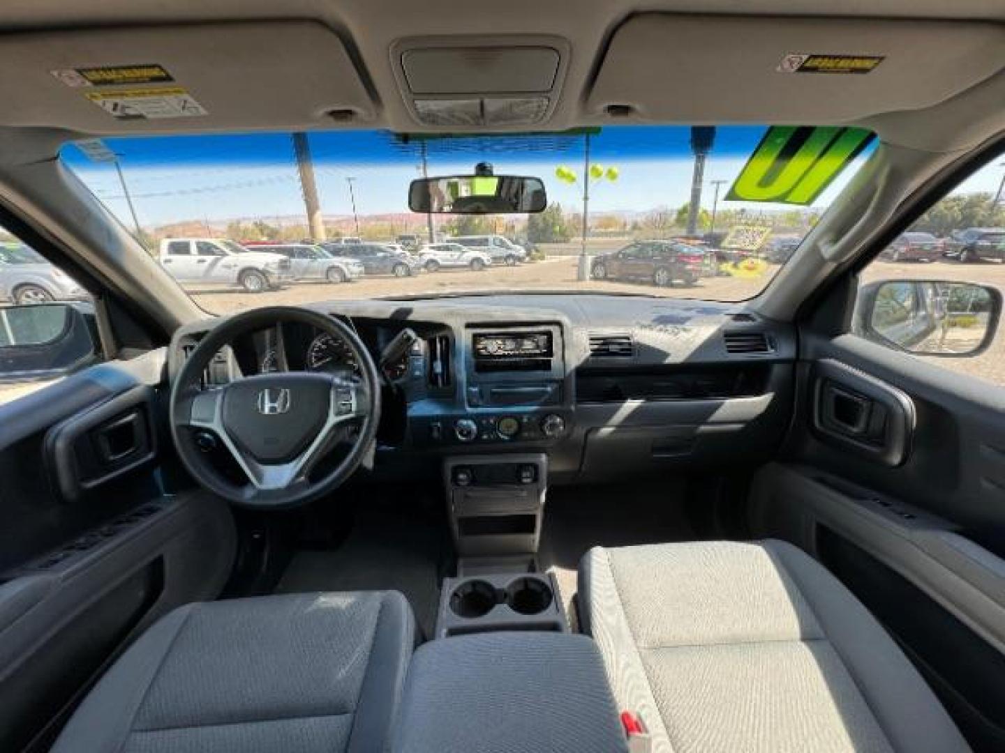 2010 Crystal Black Pearl /Beige Cloth Interior Honda Ridgeline RT (5FPYK1F23AB) with an 3.5L V6 SOHC 24V engine, 5-Speed Automatic transmission, located at 1865 East Red Hills Pkwy, St. George, 84770, (435) 628-0023, 37.120850, -113.543640 - Photo#27