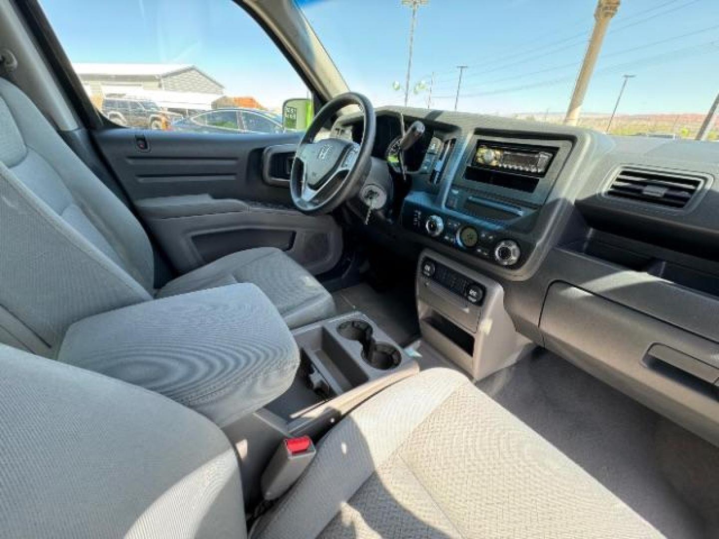 2010 Crystal Black Pearl /Beige Cloth Interior Honda Ridgeline RT (5FPYK1F23AB) with an 3.5L V6 SOHC 24V engine, 5-Speed Automatic transmission, located at 1865 East Red Hills Pkwy, St. George, 84770, (435) 628-0023, 37.120850, -113.543640 - Photo#32