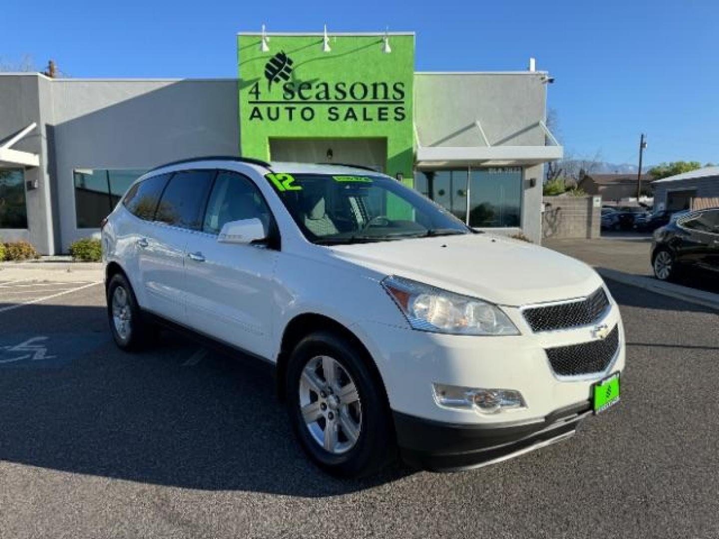 2012 White /Dark Gray Cloth Interior Chevrolet Traverse LT AWD (1GNKVGED9CJ) with an 3.6L V6 DOHC 24V engine, 6-Speed Automatic transmission, located at 940 North Main Street, Cedar City, UT, 84720, (435) 628-0023, 37.692936, -113.061897 - Photo#0