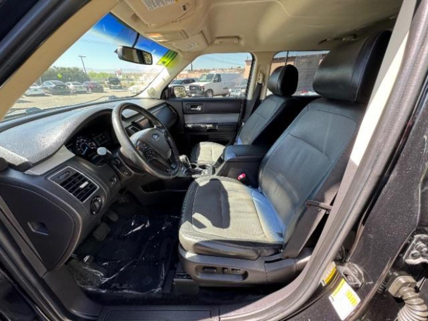 2014 Tuxedo Black Metallic /Charcoal Black Ford Flex SEL FWD (2FMGK5C88EB) with an 3.5L V6 DOHC 24V engine, 6-Speed Automatic Overdrive transmission, located at 940 North Main Street, Cedar City, UT, 84720, (435) 628-0023, 37.692936, -113.061897 - We specialize in helping ALL people get the best financing available. No matter your credit score, good, bad or none we can get you an amazing rate. Had a bankruptcy, divorce, or repossessions? We give you the green light to get your credit back on the road. Low down and affordable payments that fit - Photo#20