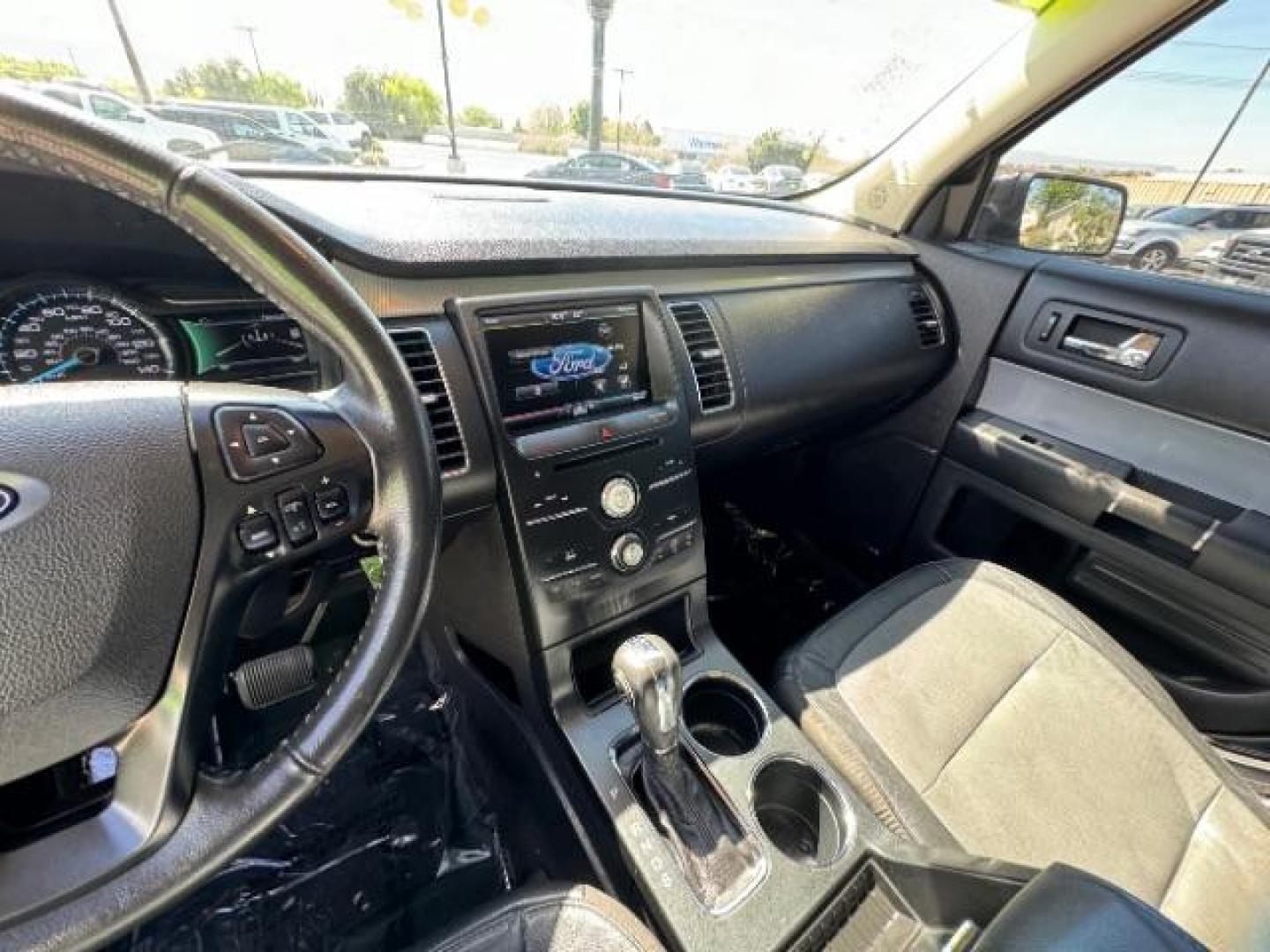 2014 Tuxedo Black Metallic /Charcoal Black Ford Flex SEL FWD (2FMGK5C88EB) with an 3.5L V6 DOHC 24V engine, 6-Speed Automatic Overdrive transmission, located at 940 North Main Street, Cedar City, UT, 84720, (435) 628-0023, 37.692936, -113.061897 - We specialize in helping ALL people get the best financing available. No matter your credit score, good, bad or none we can get you an amazing rate. Had a bankruptcy, divorce, or repossessions? We give you the green light to get your credit back on the road. Low down and affordable payments that fit - Photo#22