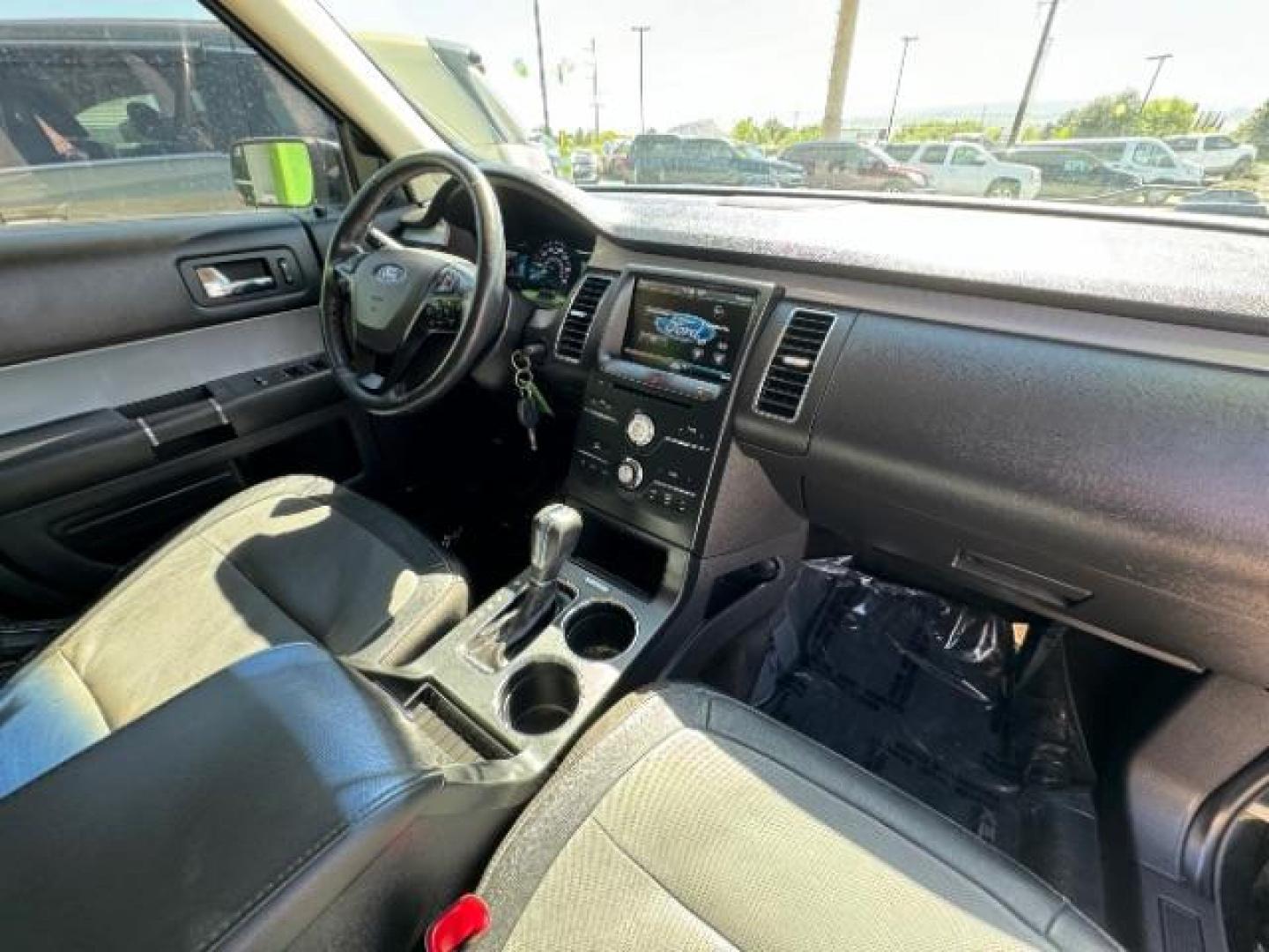 2014 Tuxedo Black Metallic /Charcoal Black Ford Flex SEL FWD (2FMGK5C88EB) with an 3.5L V6 DOHC 24V engine, 6-Speed Automatic Overdrive transmission, located at 940 North Main Street, Cedar City, UT, 84720, (435) 628-0023, 37.692936, -113.061897 - We specialize in helping ALL people get the best financing available. No matter your credit score, good, bad or none we can get you an amazing rate. Had a bankruptcy, divorce, or repossessions? We give you the green light to get your credit back on the road. Low down and affordable payments that fit - Photo#38