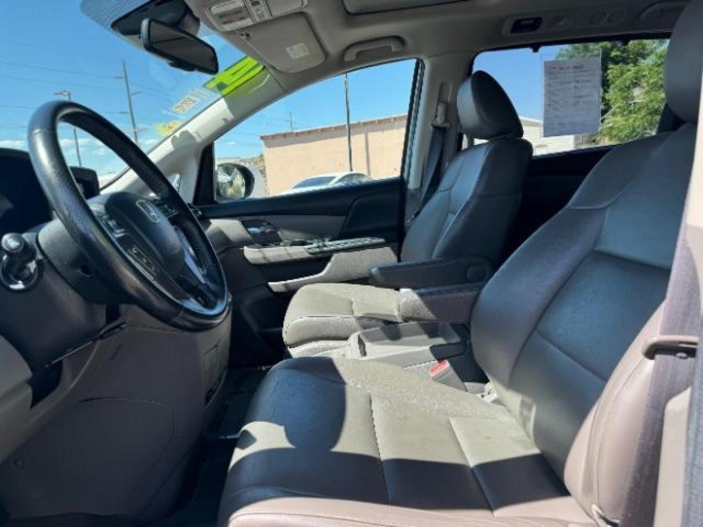 2014 Alabaster Silver Metallic /Beige Honda Odyssey EX-L (5FNRL5H62EB) with an 3.5L V6 SOHC 24V engine, 6-Speed Automatic transmission, located at 940 North Main Street, Cedar City, UT, 84720, (435) 628-0023, 37.692936, -113.061897 - We specialize in helping ALL people get the best financing available. No matter your credit score, good, bad or none we can get you an amazing rate. Had a bankruptcy, divorce, or repossessions? We give you the green light to get your credit back on the road. Low down and affordable payments that fit - Photo#15