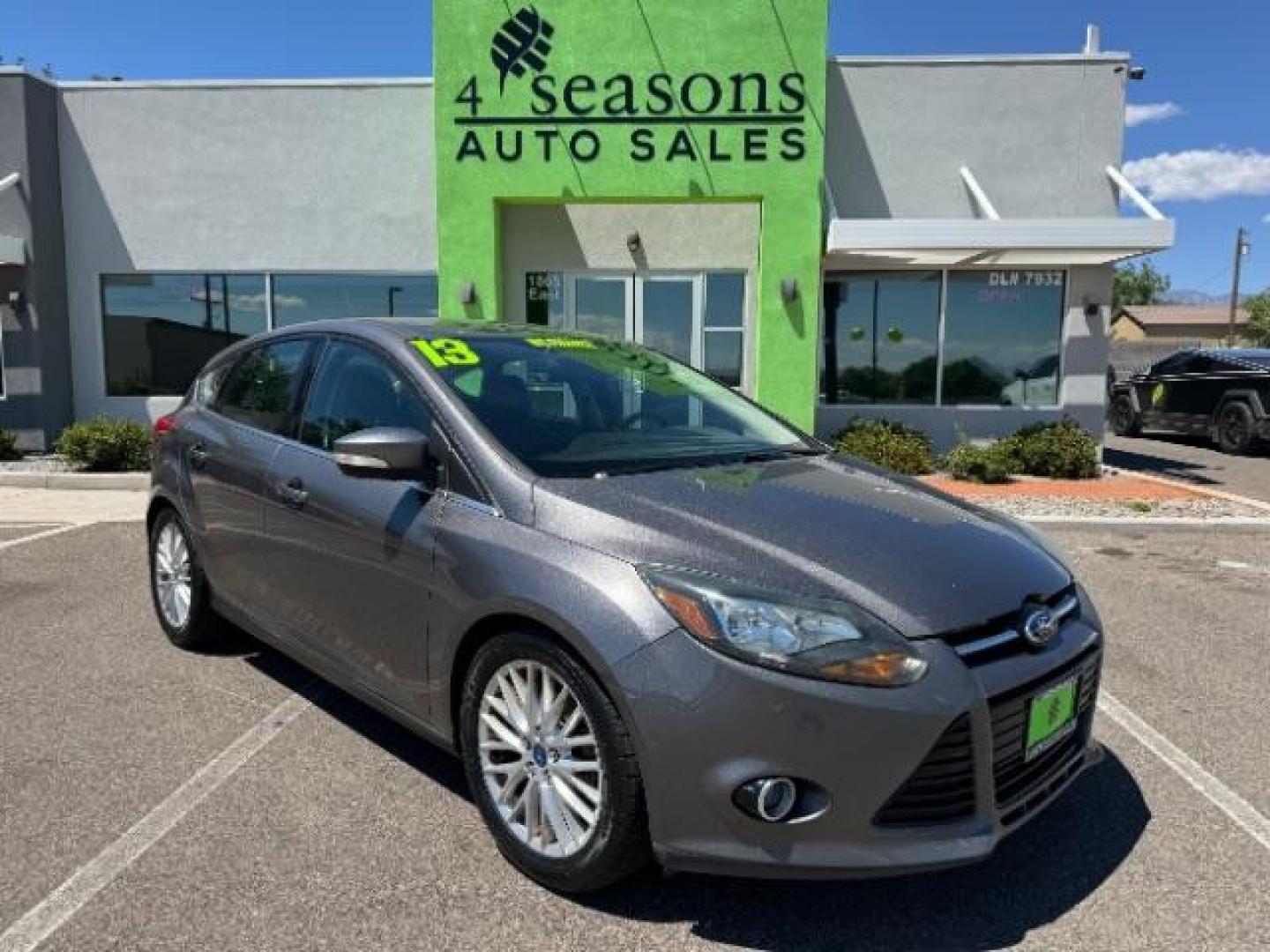 2013 Gray /Charcoal Black Ford Focus Titanium Hatch (1FADP3N23DL) with an 2.0L L4 DOHC 16V engine, 6-Speed Automatic transmission, located at 1865 East Red Hills Pkwy, St. George, 84770, (435) 628-0023, 37.120850, -113.543640 - Photo#0