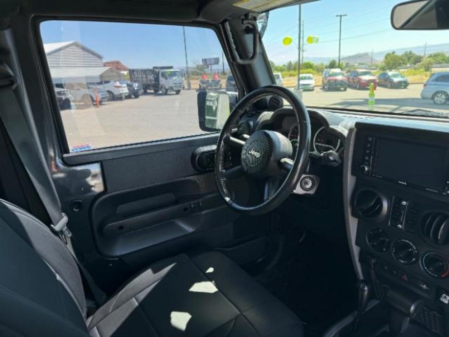 2010 Dark Charcoal Pearl with Black Hard Top /Dark Slate Gray/Medium Slate Gray Cloth Interior Jeep Wrangler Unlimited Rubicon 4WD (1J4BA6H12AL) with an 3.8L V6 OHV 12V engine, 4-Speed Automatic transmission, located at 940 North Main Street, Cedar City, UT, 84720, (435) 628-0023, 37.692936, -113.061897 - We specialize in helping ALL people get the best financing available. No matter your credit score, good, bad or none we can get you an amazing rate. Had a bankruptcy, divorce, or repossessions? We give you the green light to get your credit back on the road. Low down and affordable payments that fit - Photo#31