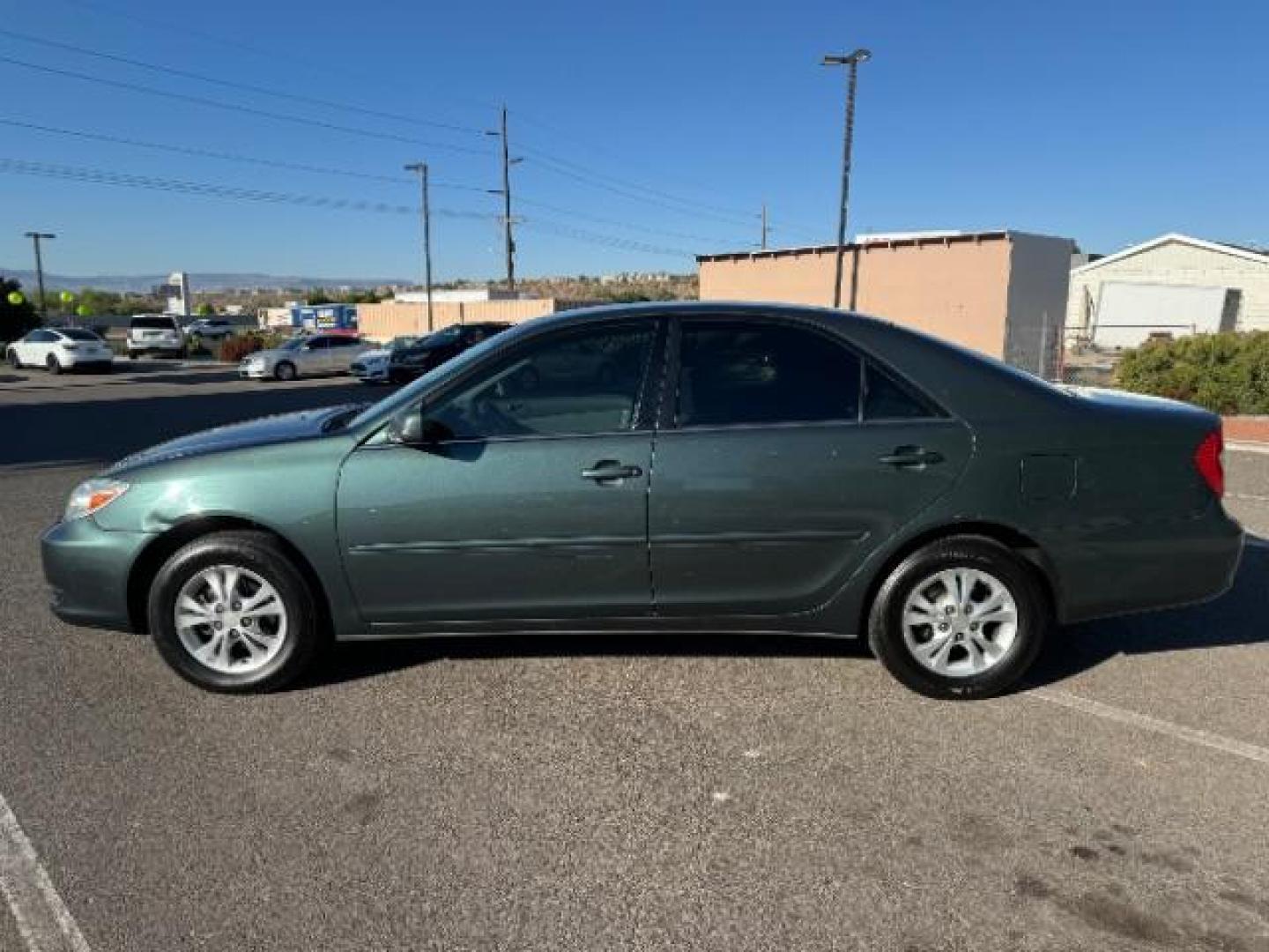 2004 Aspen Green Pearl /Stone Cloth Interior Toyota Camry LE V6 (4T1BF32K64U) with an 3.0L V6 DOHC 24V engine, 5-Speed Automatic transmission, located at 1865 East Red Hills Pkwy, St. George, 84770, (435) 628-0023, 37.120850, -113.543640 - We specialize in helping ALL people get the best financing available. No matter your credit score, good, bad or none we can get you an amazing rate. Had a bankruptcy, divorce, or repossessions? We give you the green light to get your credit back on the road. Low down and affordable payments that fit - Photo#3