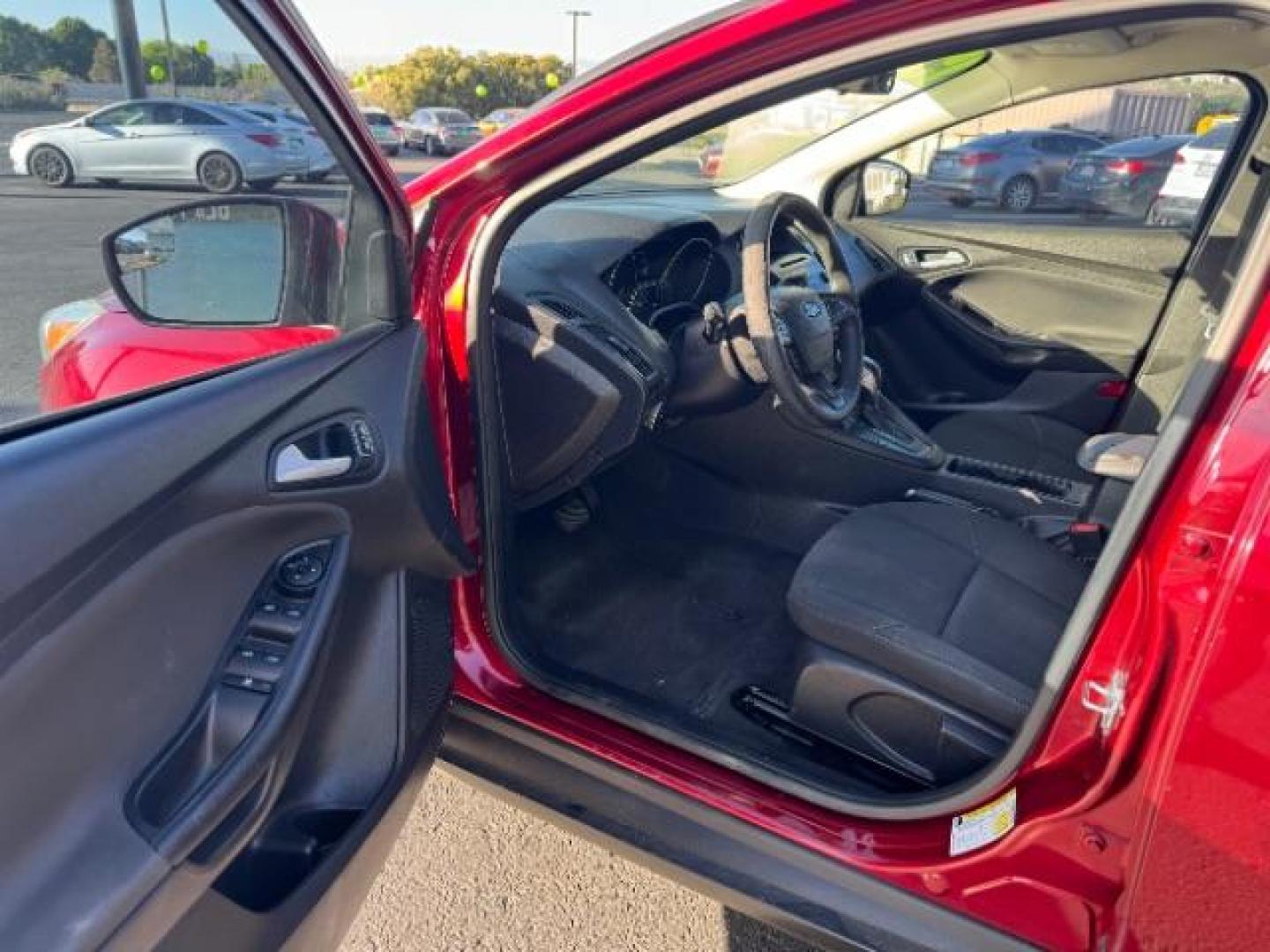 2015 Race Red /Charcoal Black Insert w/Warm Steel Surround, cloth Ford Focus SE Hatch (1FADP3K21FL) with an 2.0L L4 DOHC 16V engine, 5-Speed Manual transmission, located at 940 North Main Street, Cedar City, UT, 84720, (435) 628-0023, 37.692936, -113.061897 - Photo#12