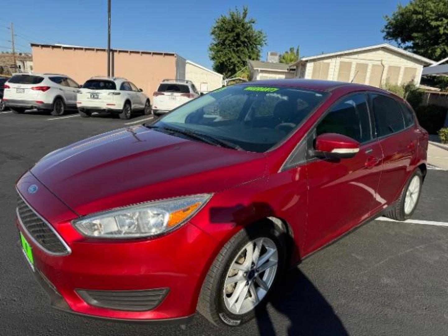 2015 Race Red /Charcoal Black Insert w/Warm Steel Surround, cloth Ford Focus SE Hatch (1FADP3K21FL) with an 2.0L L4 DOHC 16V engine, 5-Speed Manual transmission, located at 940 North Main Street, Cedar City, UT, 84720, (435) 628-0023, 37.692936, -113.061897 - We specialize in helping ALL people get the best financing available. No matter your credit score, good, bad or none we can get you an amazing rate. Had a bankruptcy, divorce, or repossessions? We give you the green light to get your credit back on the road. Low down and affordable payments that fit - Photo#2