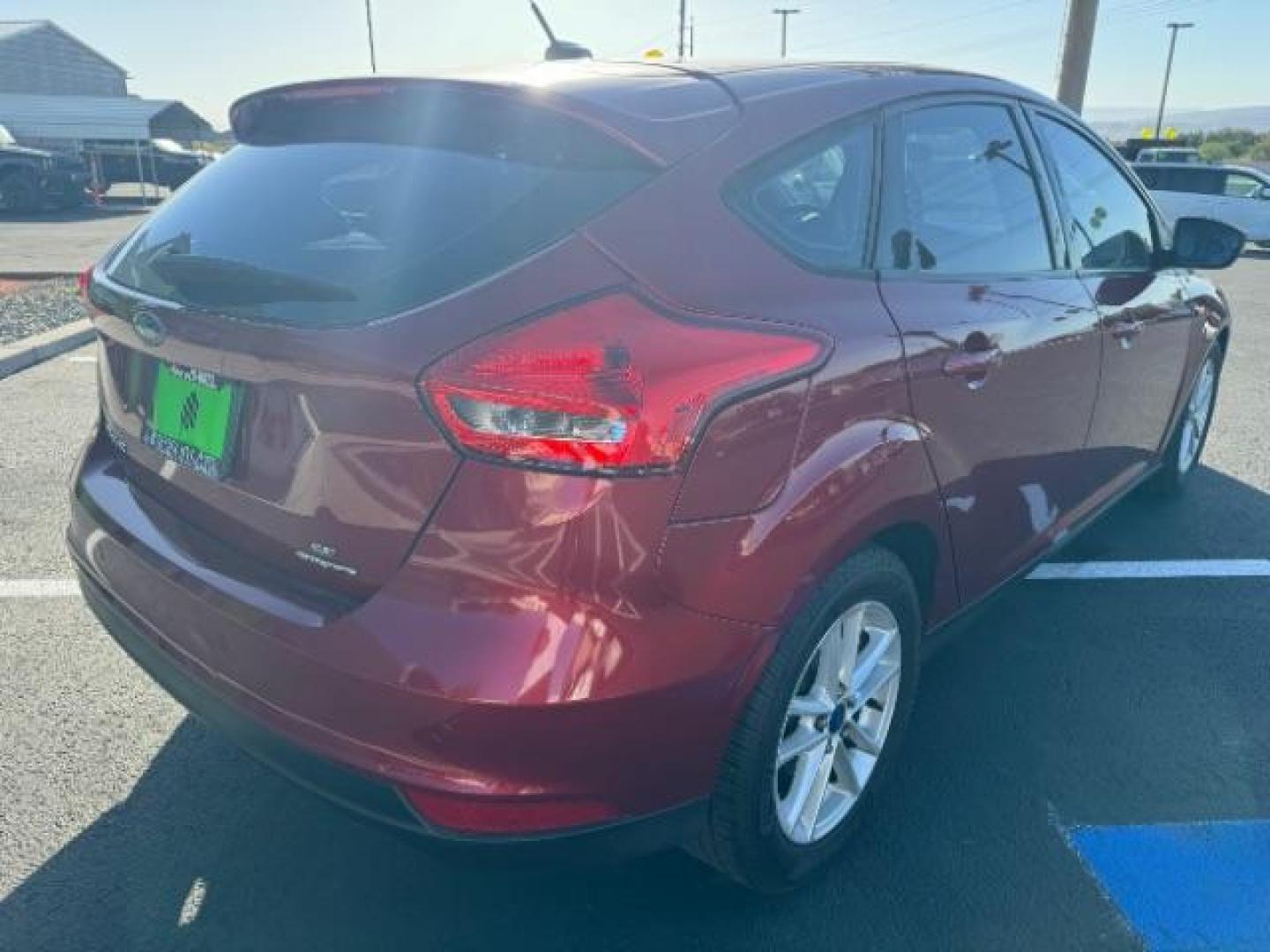 2015 Race Red /Charcoal Black Insert w/Warm Steel Surround, cloth Ford Focus SE Hatch (1FADP3K21FL) with an 2.0L L4 DOHC 16V engine, 5-Speed Manual transmission, located at 940 North Main Street, Cedar City, UT, 84720, (435) 628-0023, 37.692936, -113.061897 - We specialize in helping ALL people get the best financing available. No matter your credit score, good, bad or none we can get you an amazing rate. Had a bankruptcy, divorce, or repossessions? We give you the green light to get your credit back on the road. Low down and affordable payments that fit - Photo#6